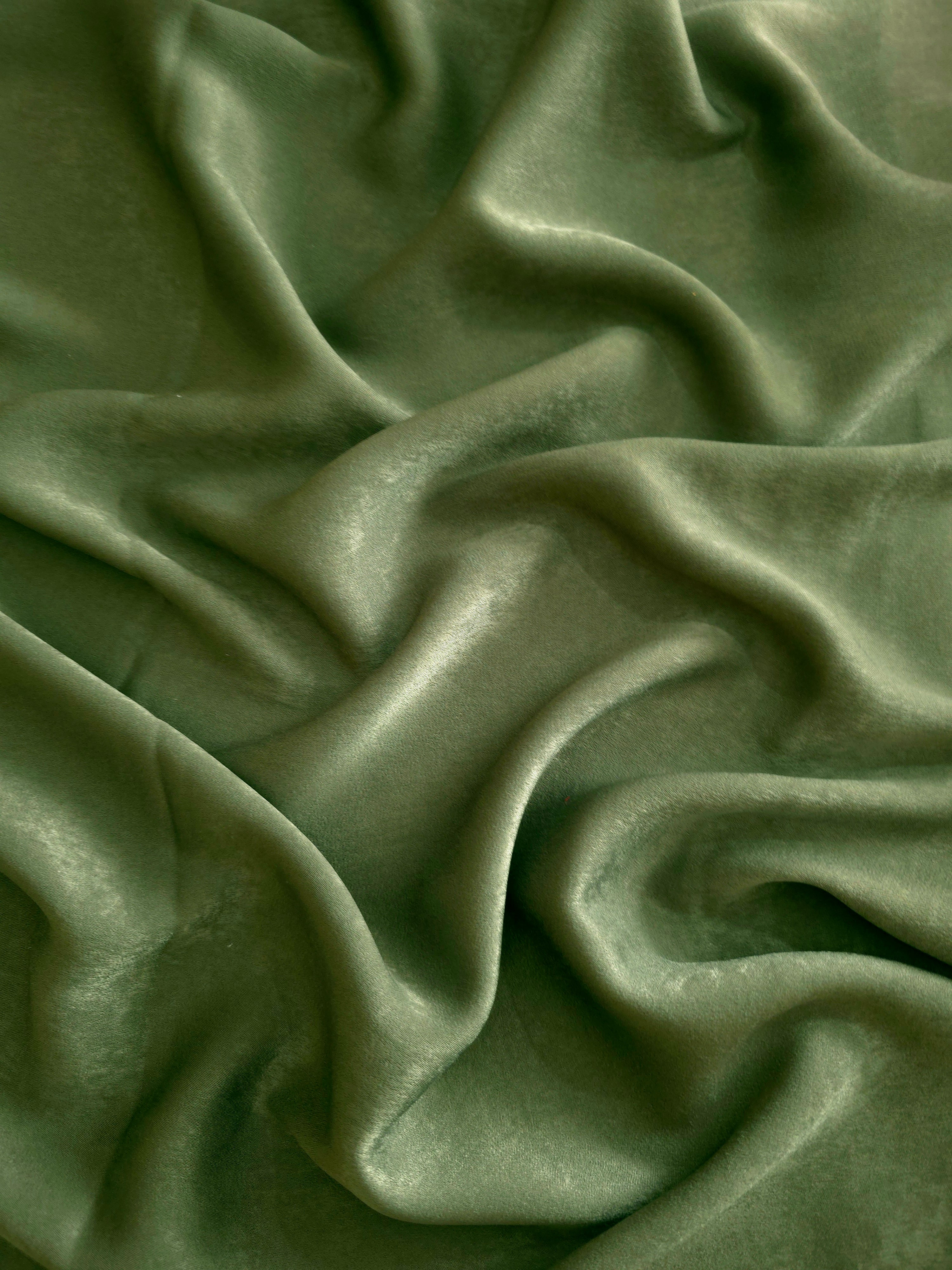 Milano matte sandwashed silky fabric in Loden Moss, shown as a soft textile for dresses, blouses and apparel