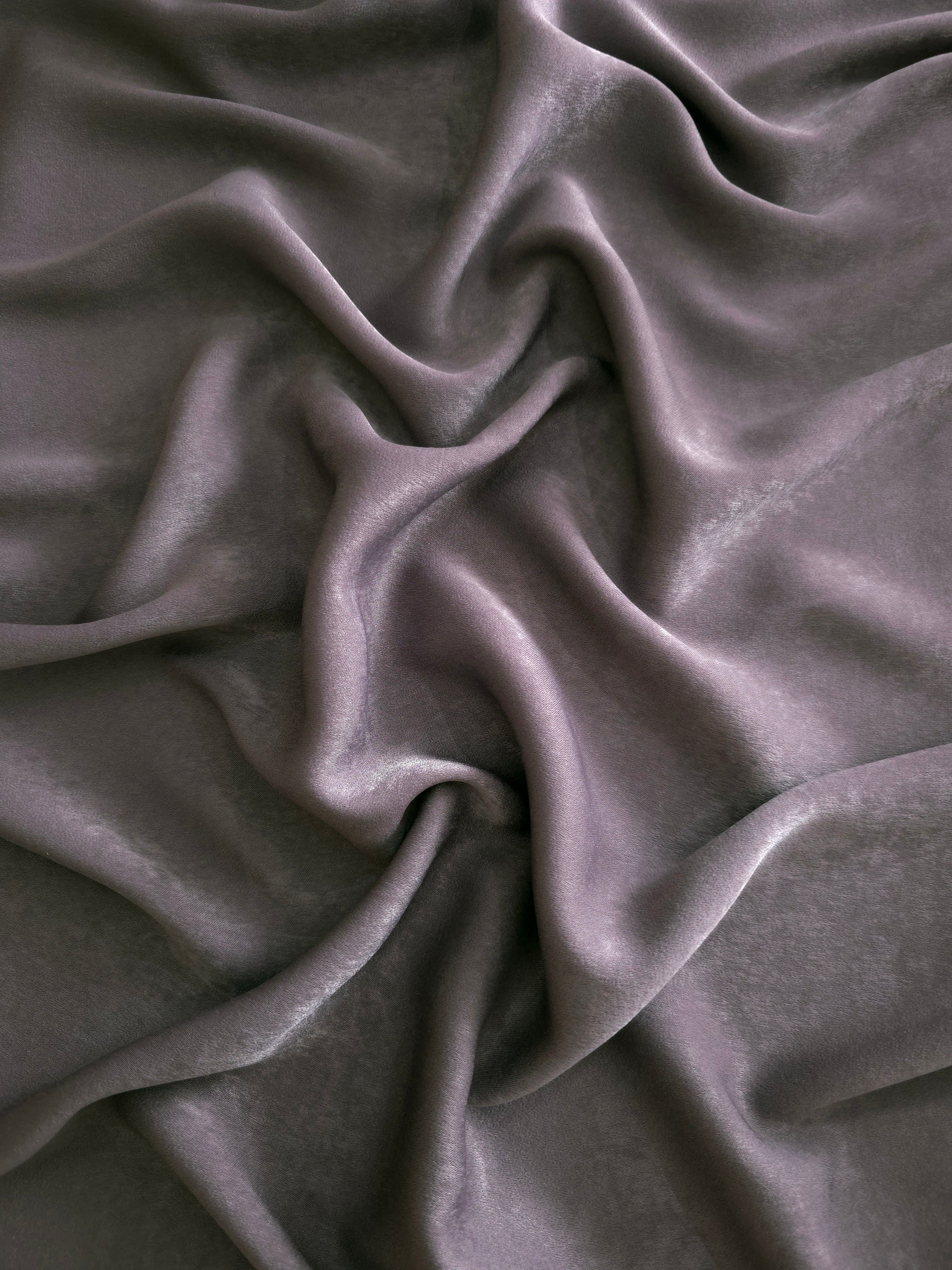 Milano matte sandwashed silky fabric in Mauve Smoke, shown as a soft textile for dresses, blouses and apparel