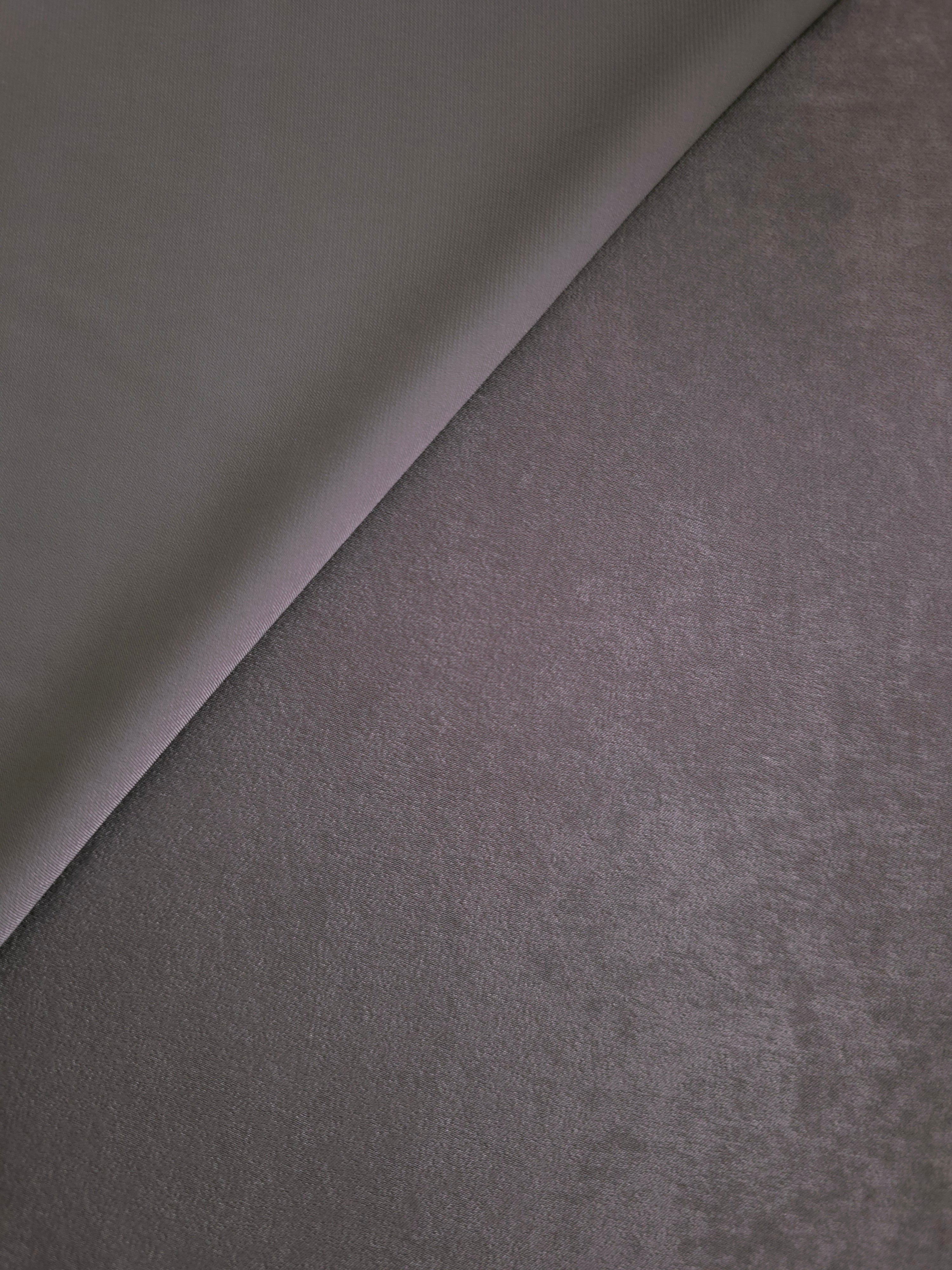 Close-up of Mauve Smoke Milano sandwashed silky fabric showing its smooth matte texture and soft surface