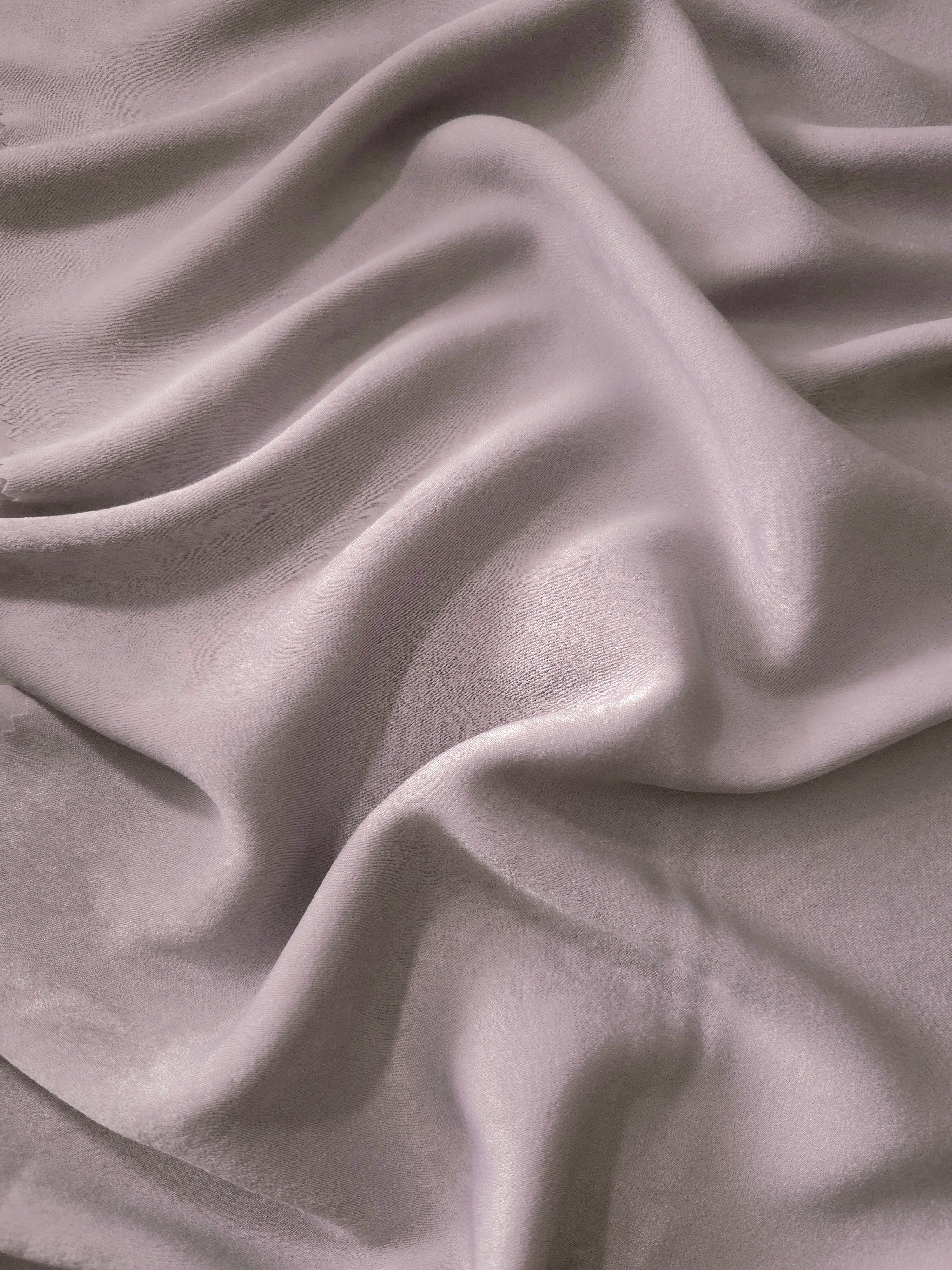 Milano matte sandwashed silky fabric in Mauve Stone, shown as a soft textile for dresses, blouses and apparel