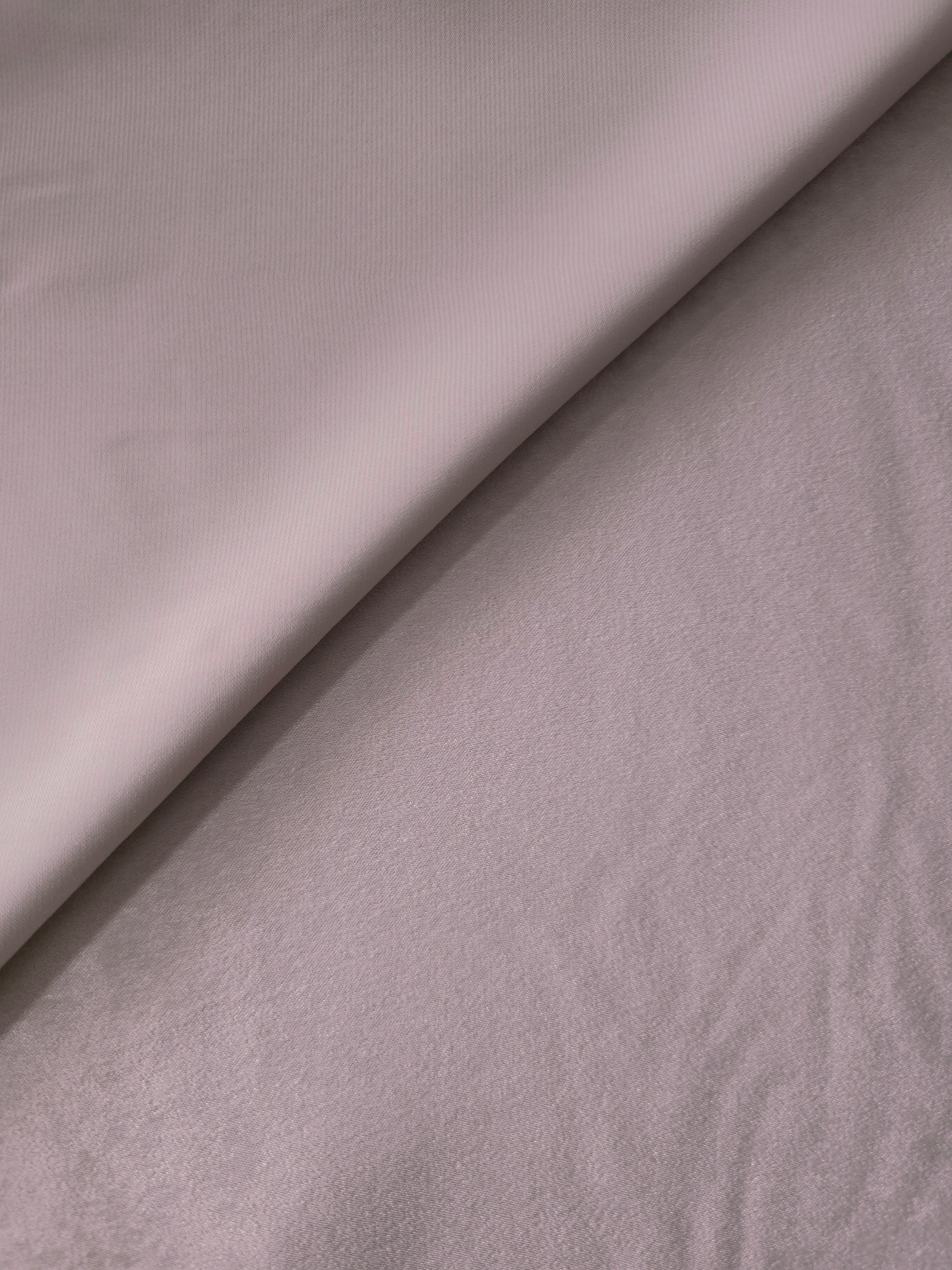 Close-up of Mauve Stone Milano sandwashed silky fabric showing its smooth matte texture and soft surface