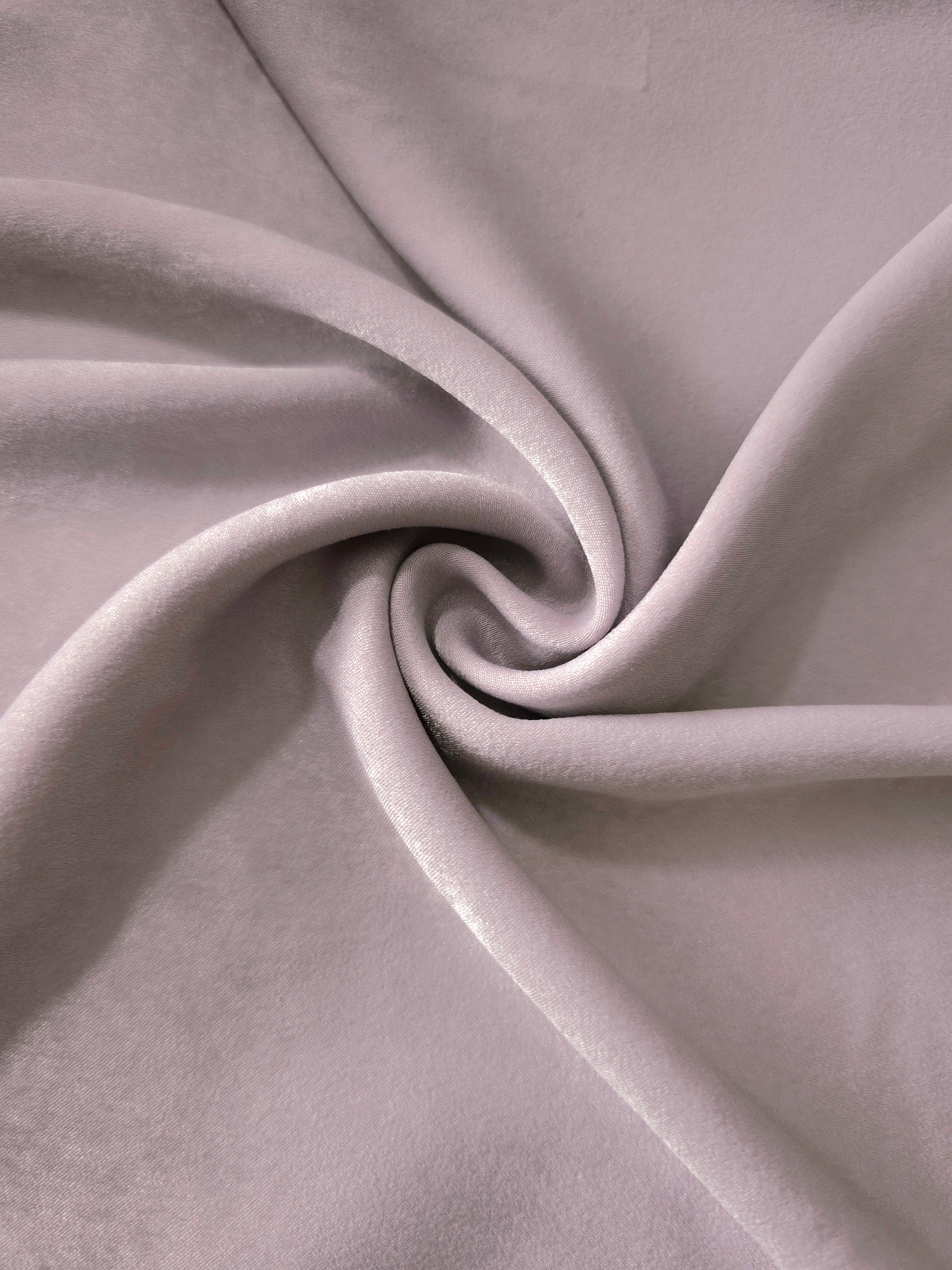 Soft folded detail of Mauve Stone Milano sandwashed silky fabric highlighting its matte finish and supple hand