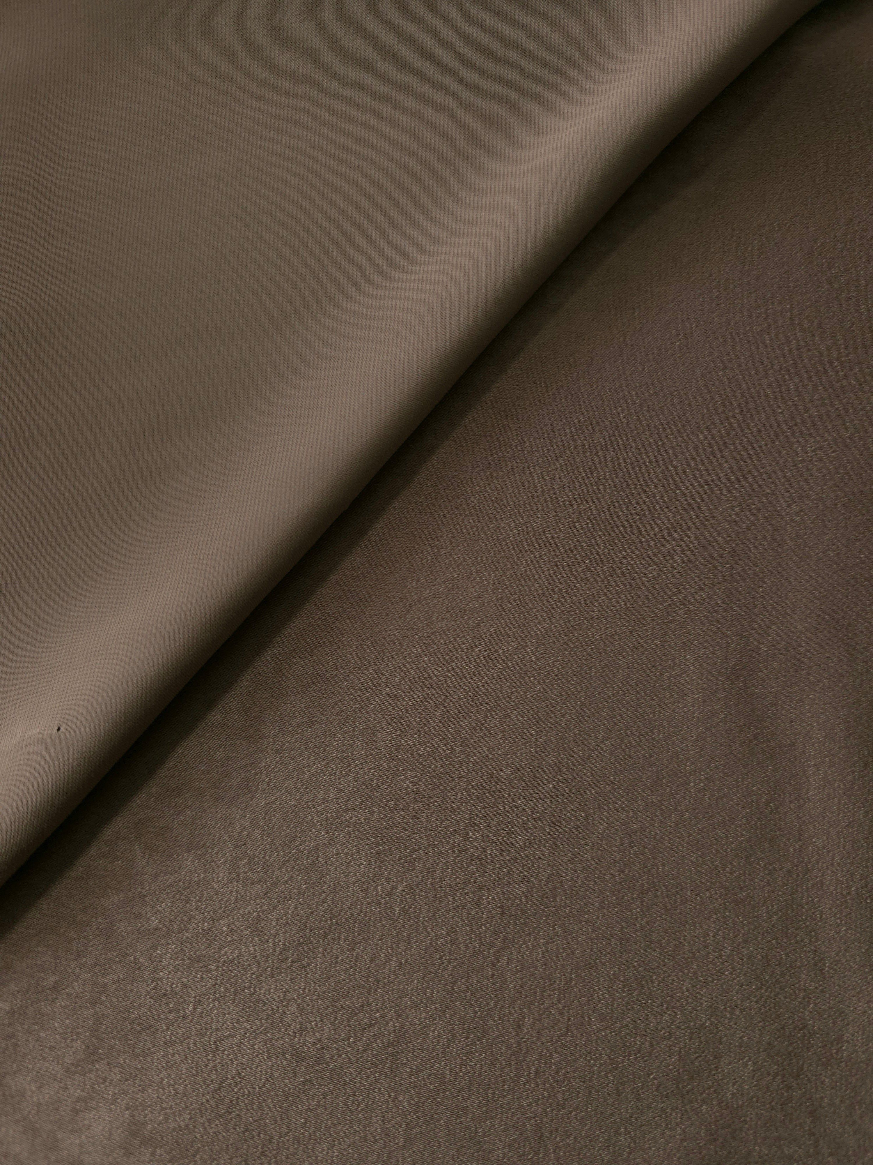 Close-up of Olive Walnut Milano sandwashed silky fabric showing its smooth matte texture and soft surface