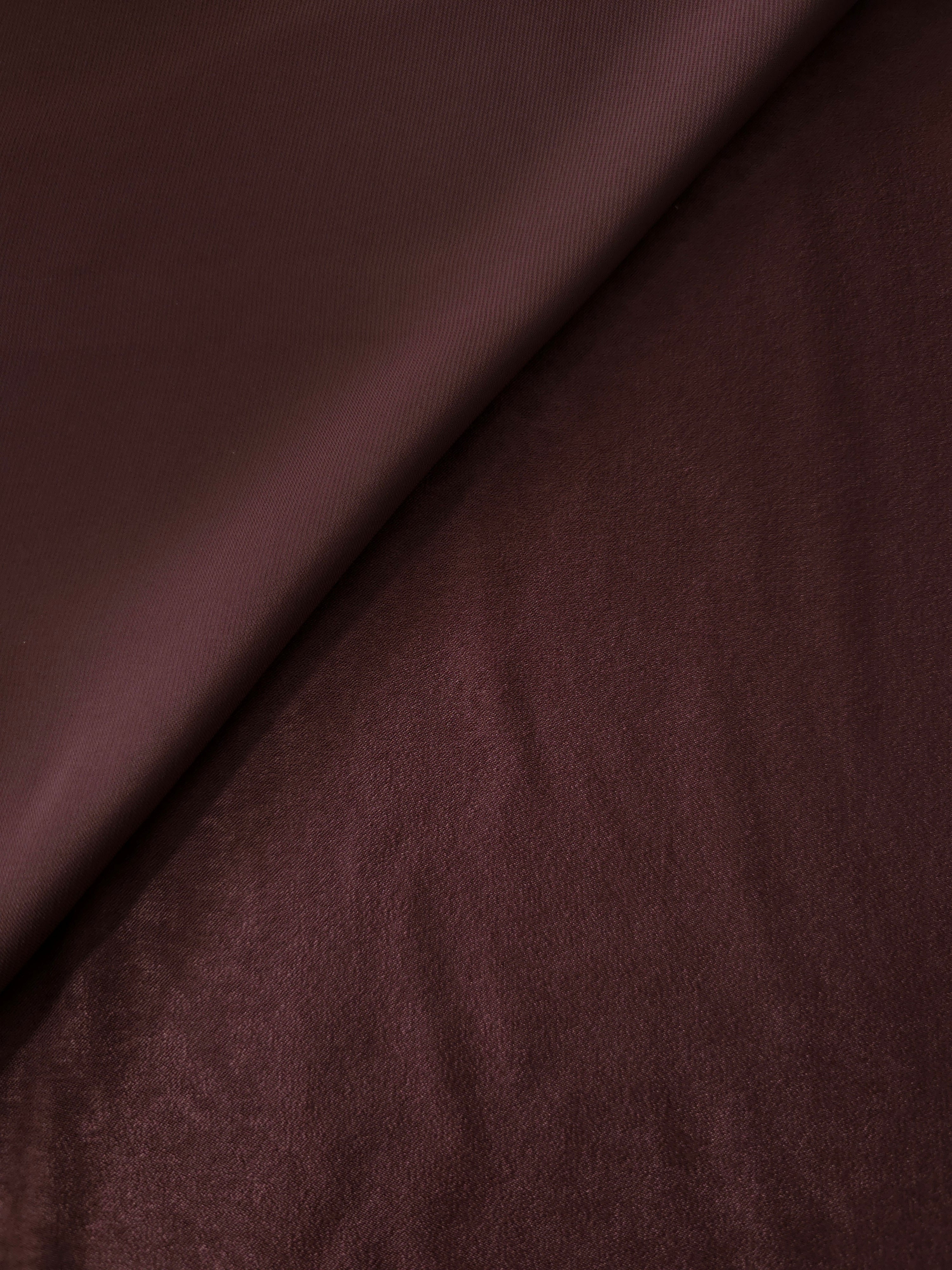 Close-up of Oxblood Mahogany Milano sandwashed silky fabric showing its smooth matte texture and soft surface