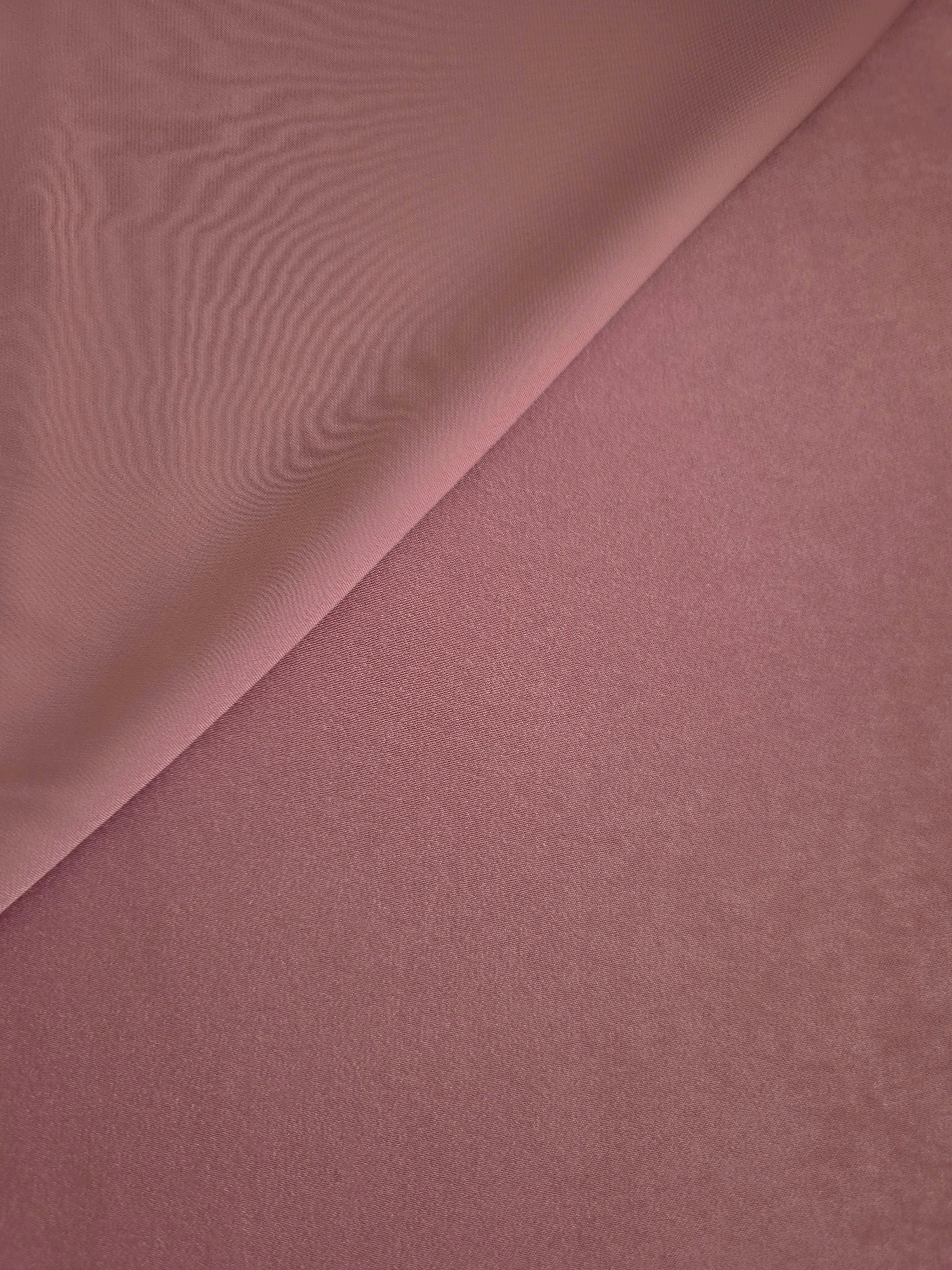 Close-up of Rosewood Mauve Milano sandwashed silky fabric showing its smooth matte texture and soft surface