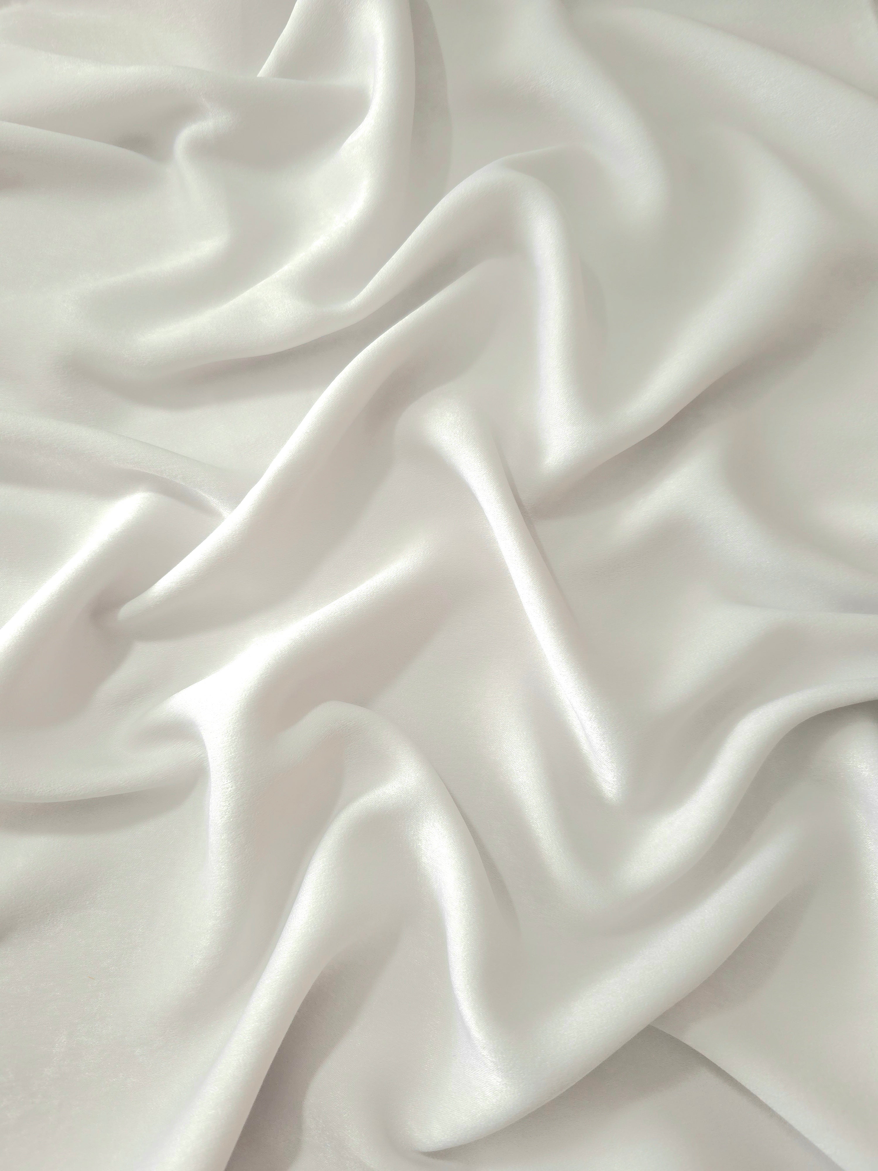 Milano matte sandwashed silky fabric in Silver Sage, shown as a soft textile for dresses, blouses and apparel