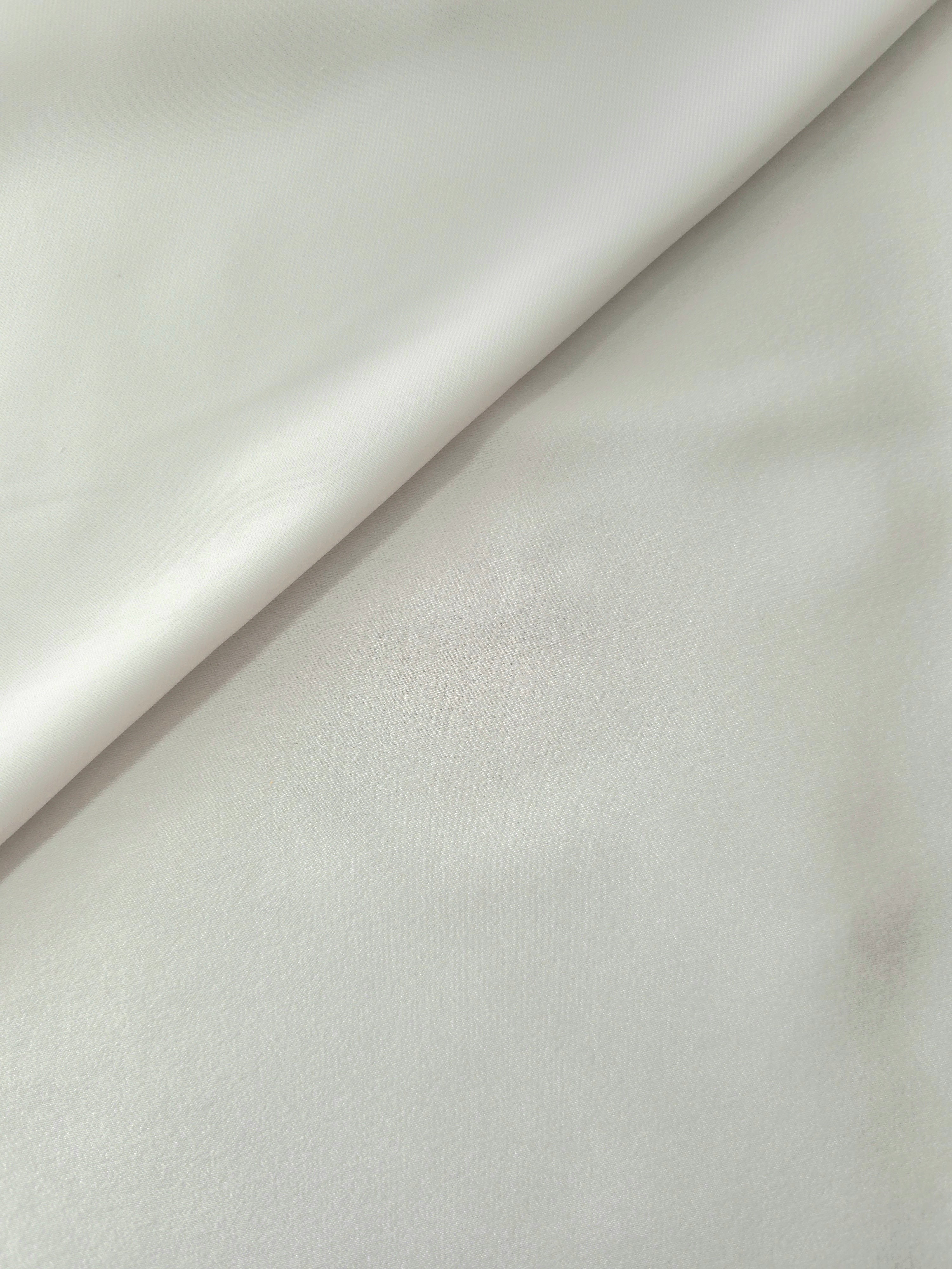 Close-up of Silver Sage Milano sandwashed silky fabric showing its smooth matte texture and soft surface