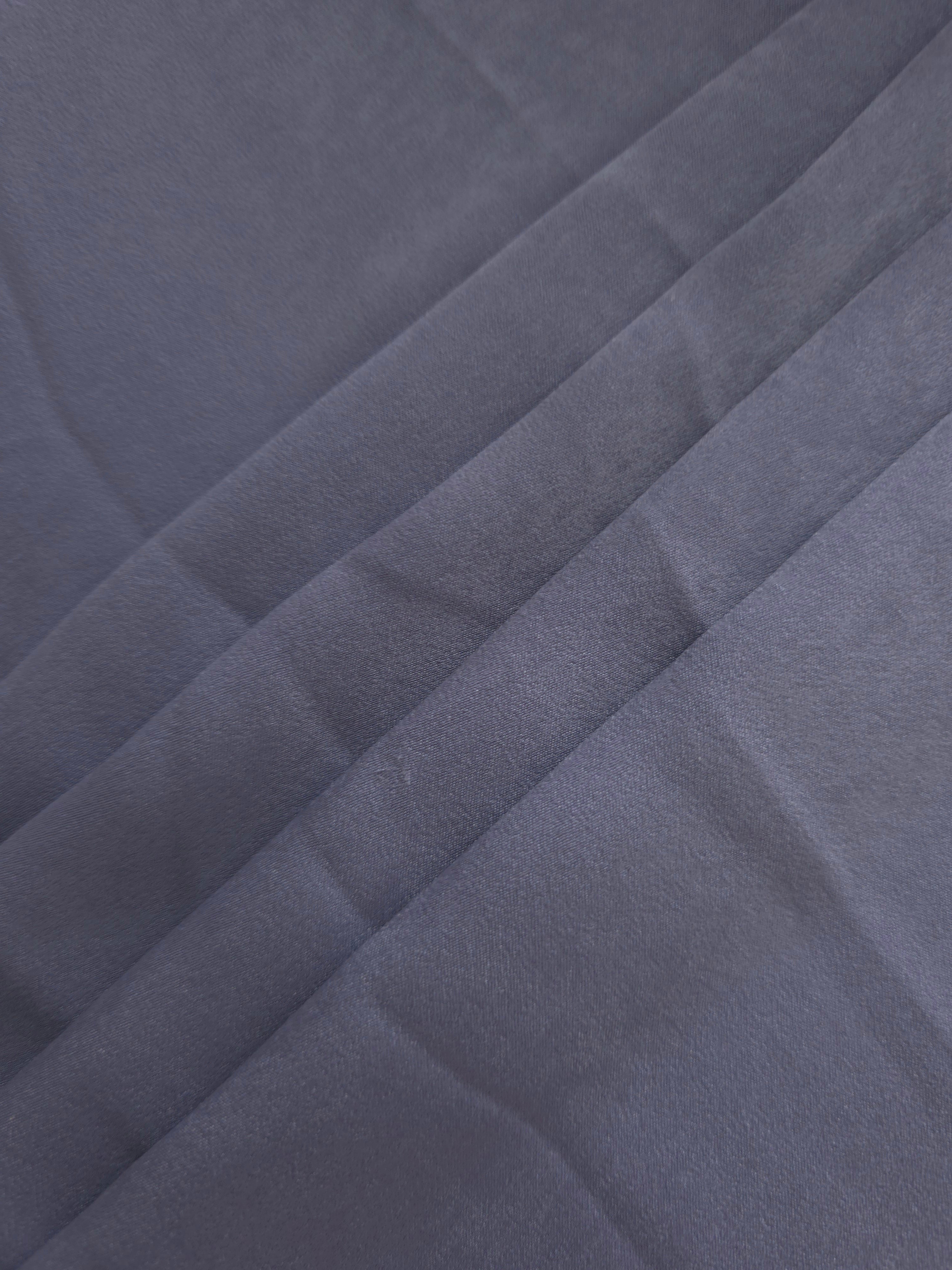 Soft folded detail of Slate Lavender Milano sandwashed silky fabric highlighting its matte finish and supple hand