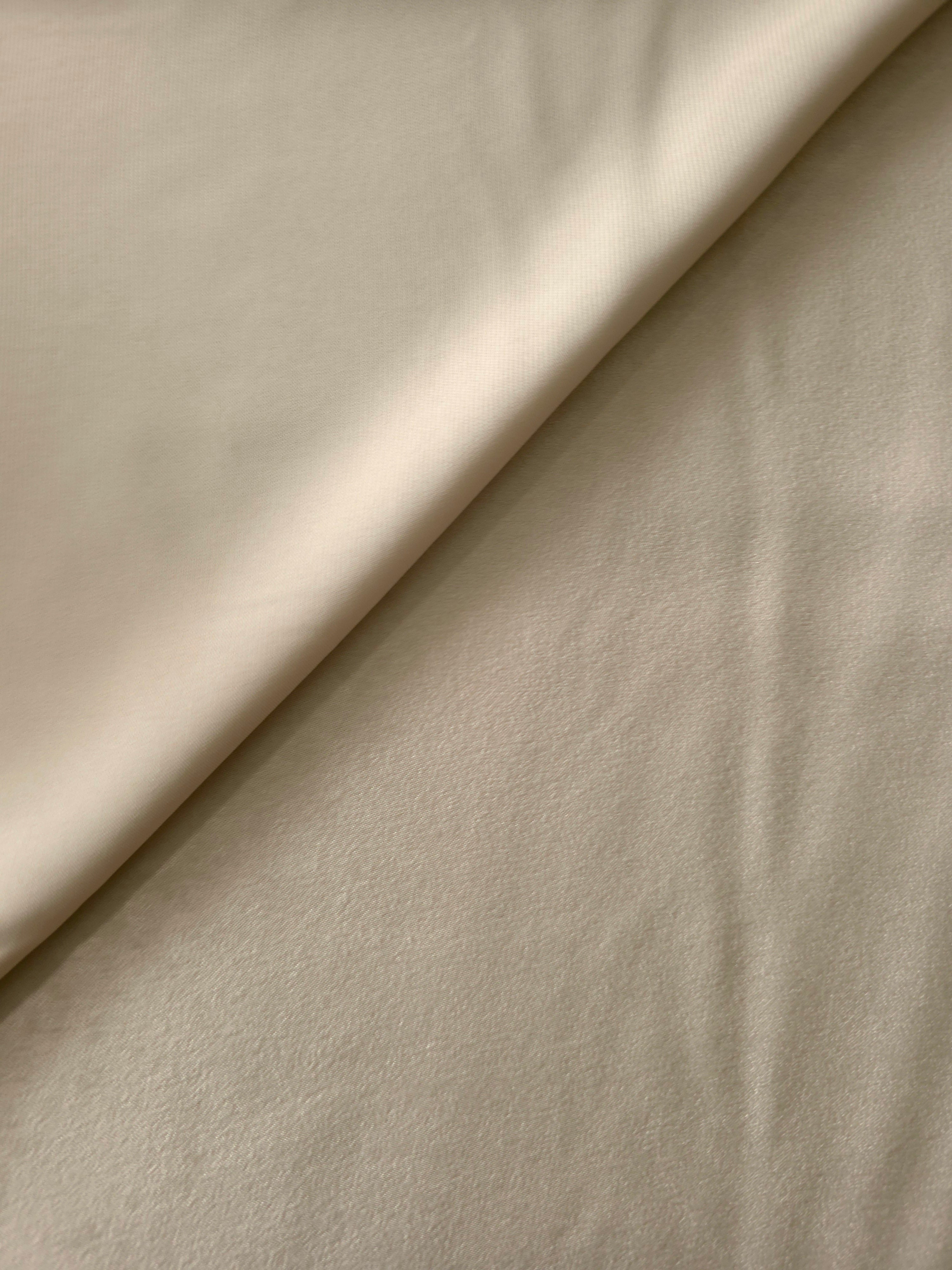 Draped Warm Greige Milano matte sandwashed silky fabric showing fluid movement for dresses and occasionwear