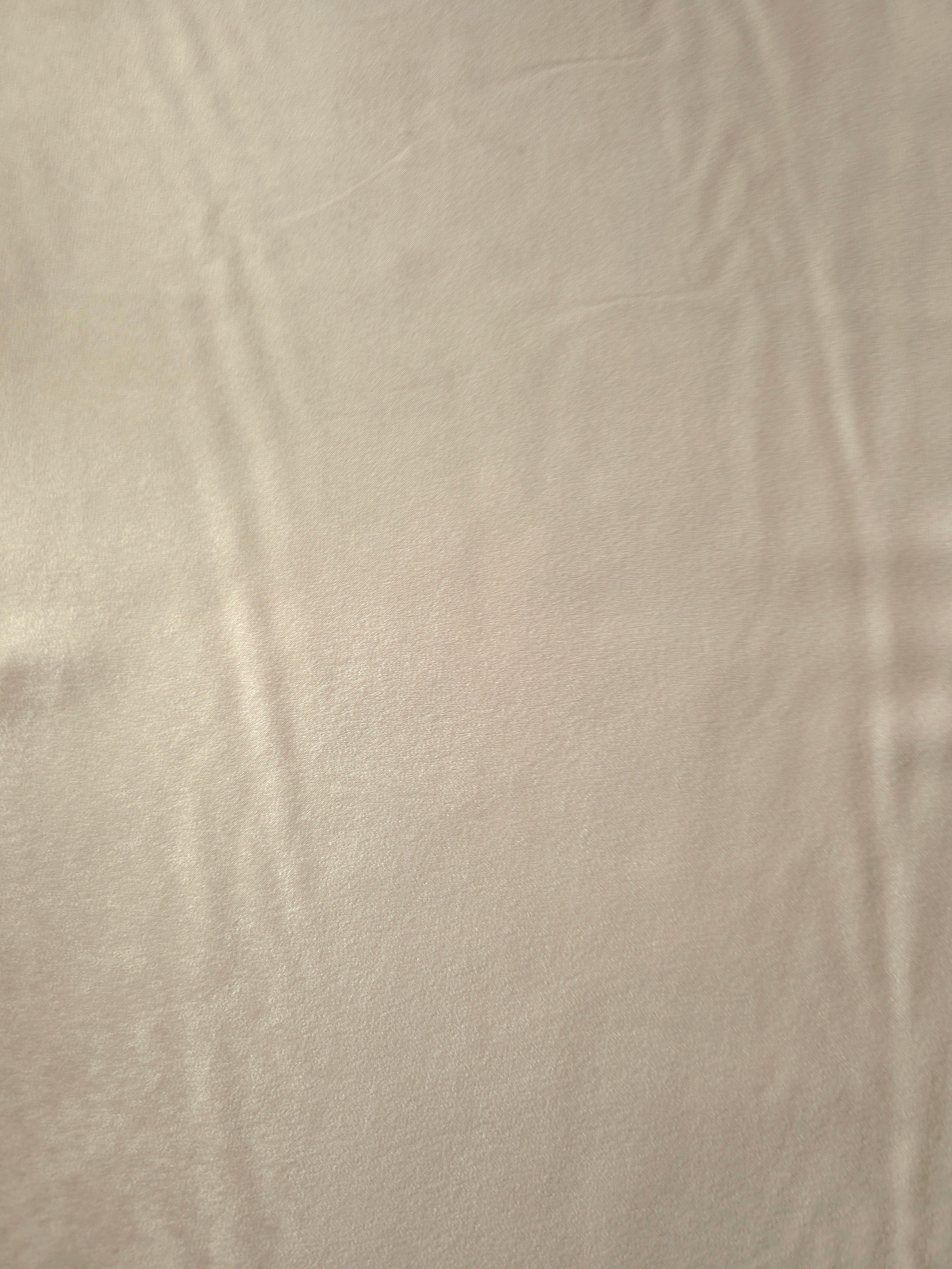 Warm Greige Milano sandwashed silky fabric with a soft fluid drape and smooth flowing folds