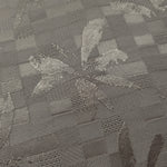 Close-up of tonal flower brick jacquard showing floral square-weave surface.