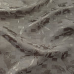 Wave fold of tonal flower brick jacquard showing soft woven sheen.