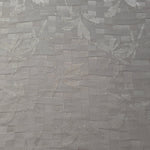 Wide view of flower brick jacquard fabric for dresses and separates.