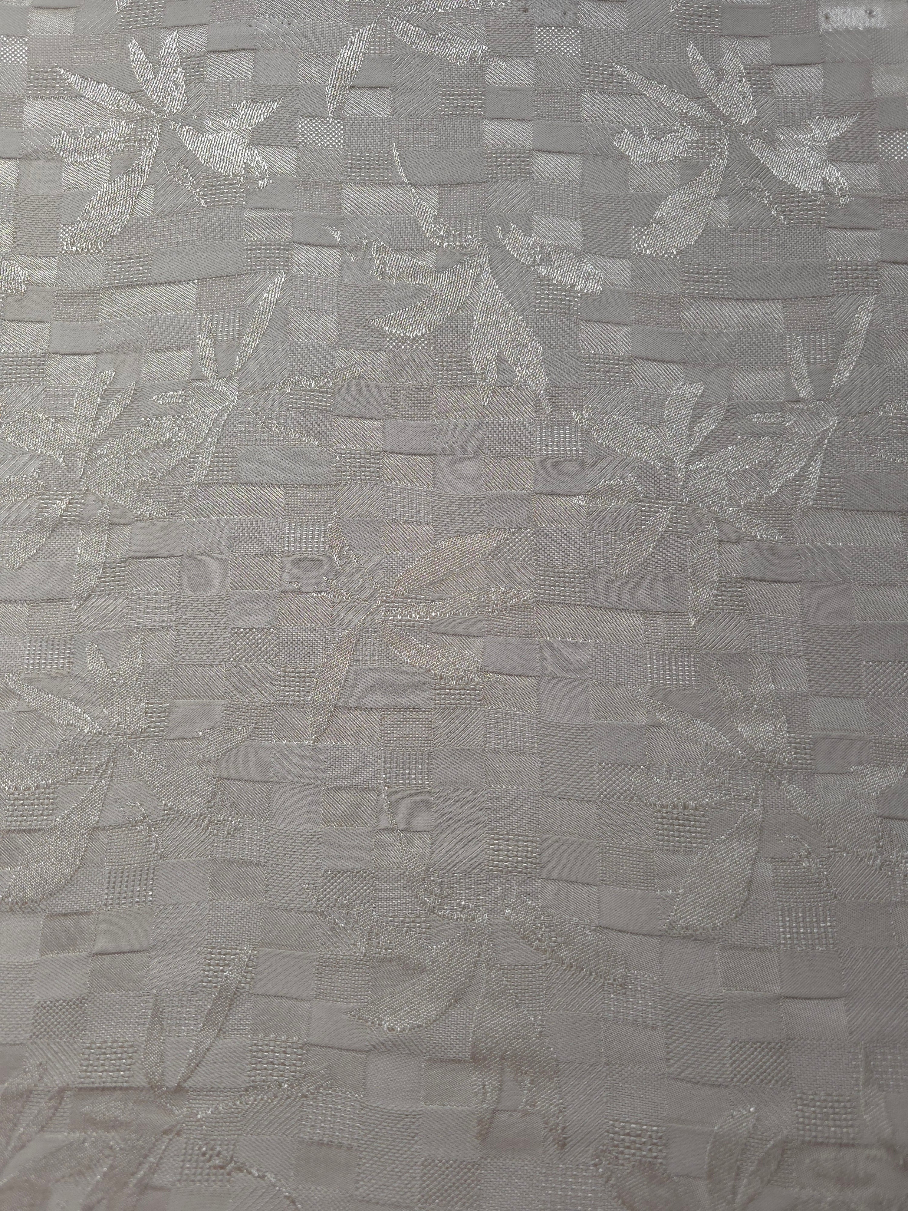 Wide view of flower brick jacquard fabric for dresses and separates.