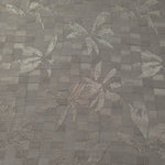 Wide view of tonal flower brick jacquard fabric for garment panels.