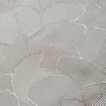 Close-up of mosaic square-weave jacquard showing tonal woven texture.
