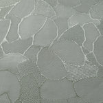 Close-up of mosaic jacquard colourway showing square-weave texture.