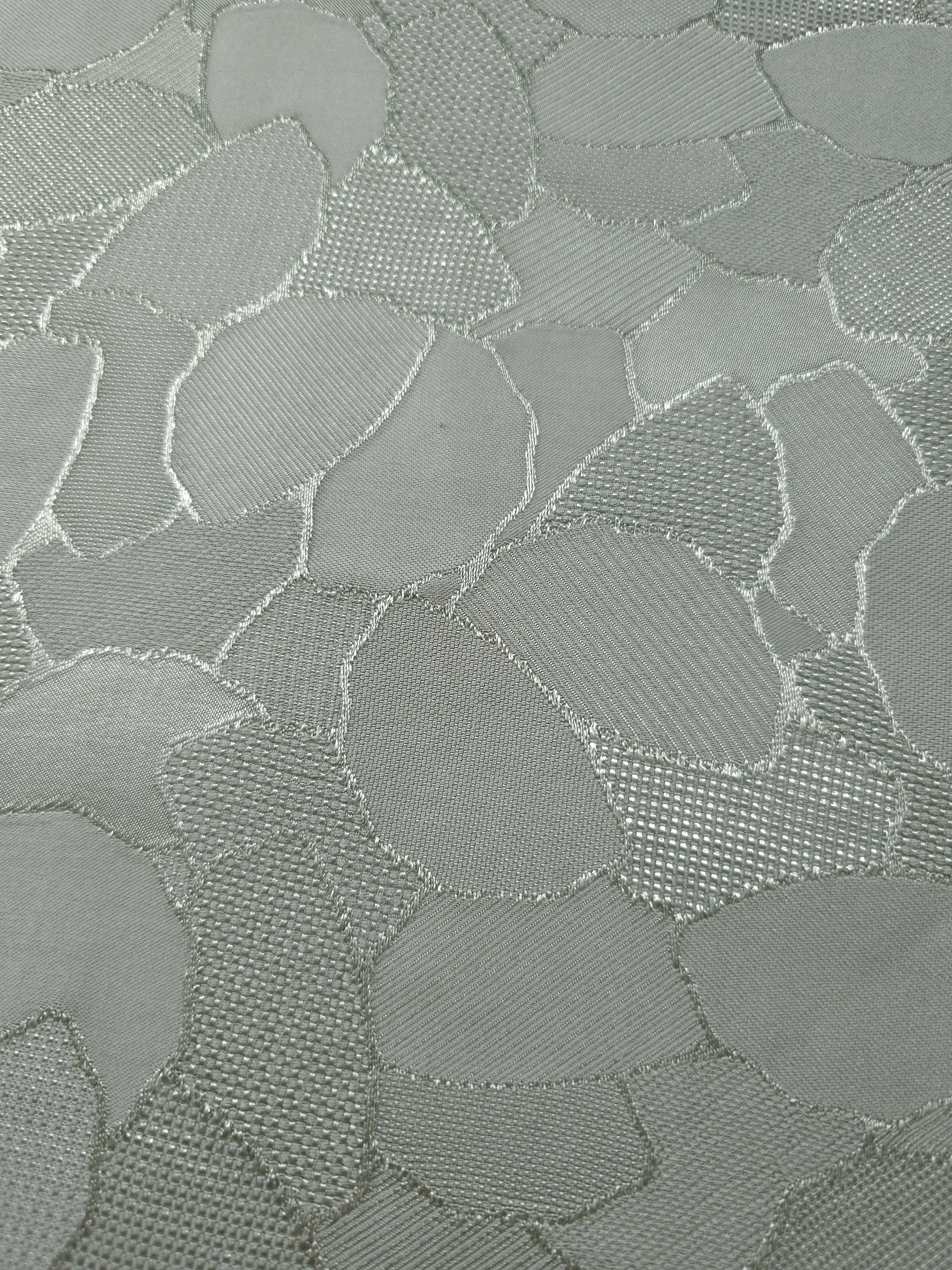 Close-up of mosaic jacquard colourway showing square-weave texture.