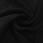 Draped mosaic jacquard in another colourway showing soft square-weave texture.
