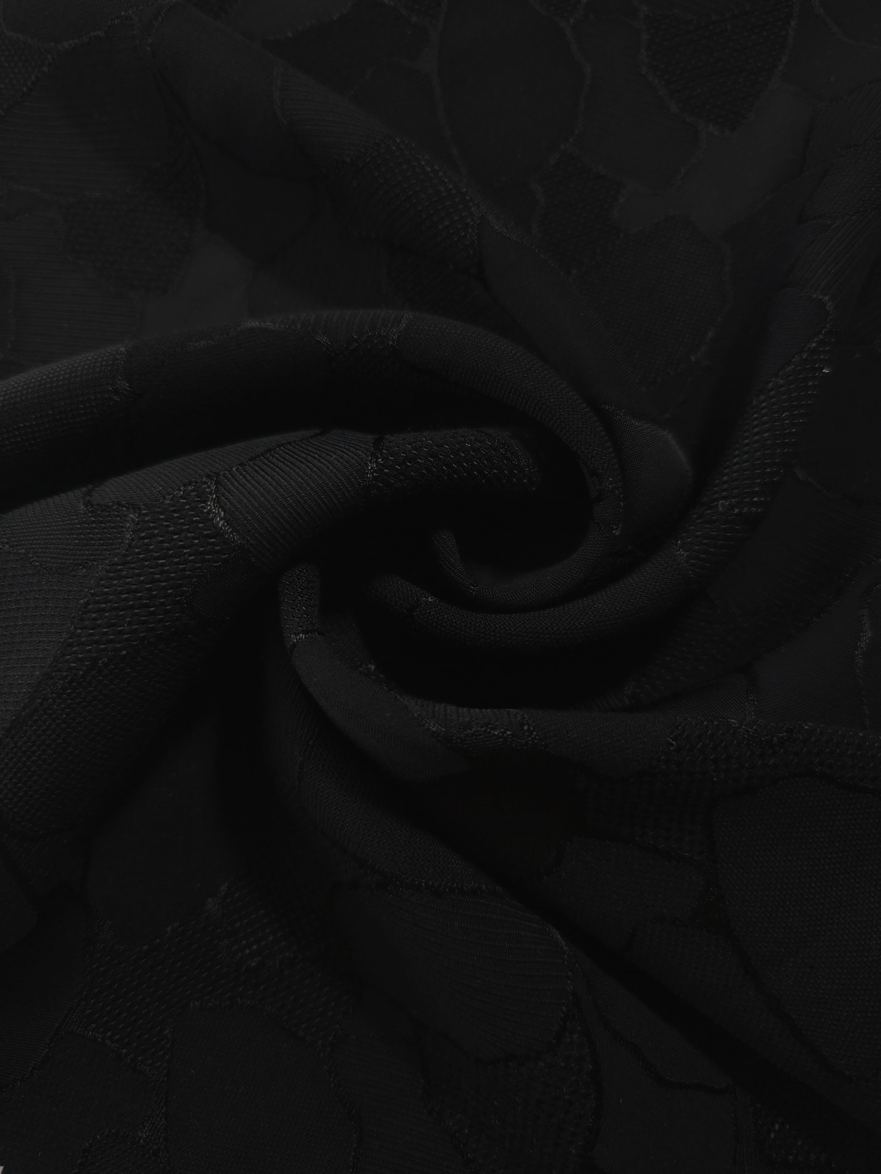Draped mosaic jacquard in another colourway showing soft square-weave texture.