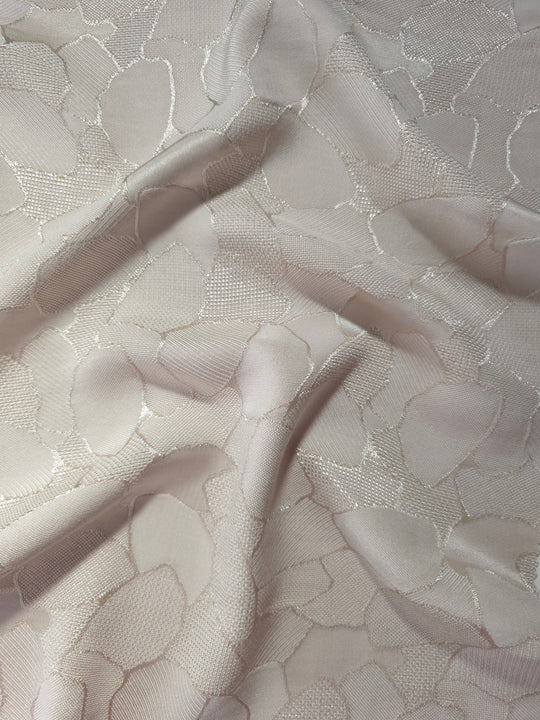 Wave fold of mosaic square-weave jacquard showing satin-on-matte pattern.