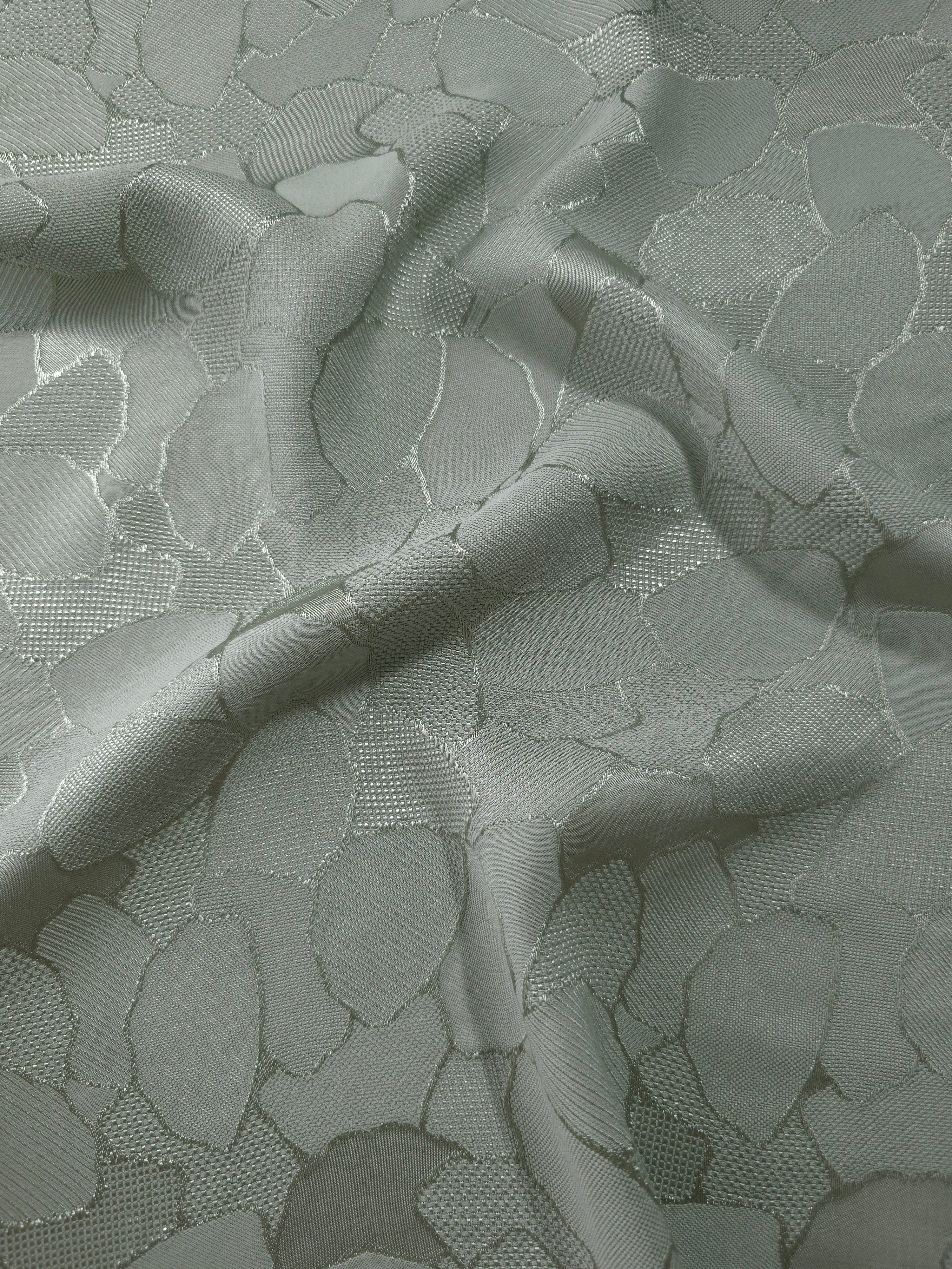 Wave fold of mosaic jacquard colourway showing tonal satin motif.