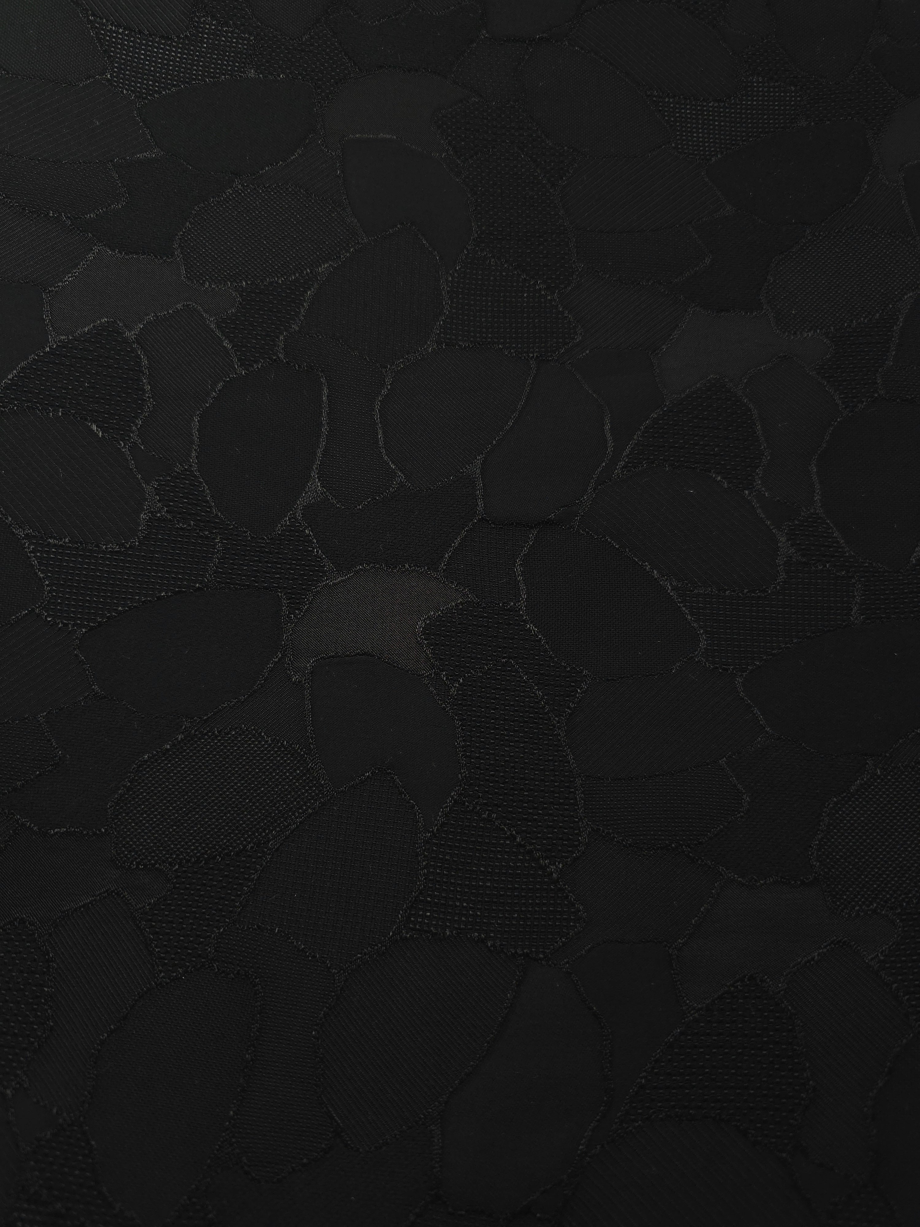 Wide view of mosaic jacquard in another colourway for garment panels.