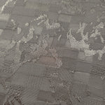 Close-up of tonal splash brick jacquard showing square-weave surface.