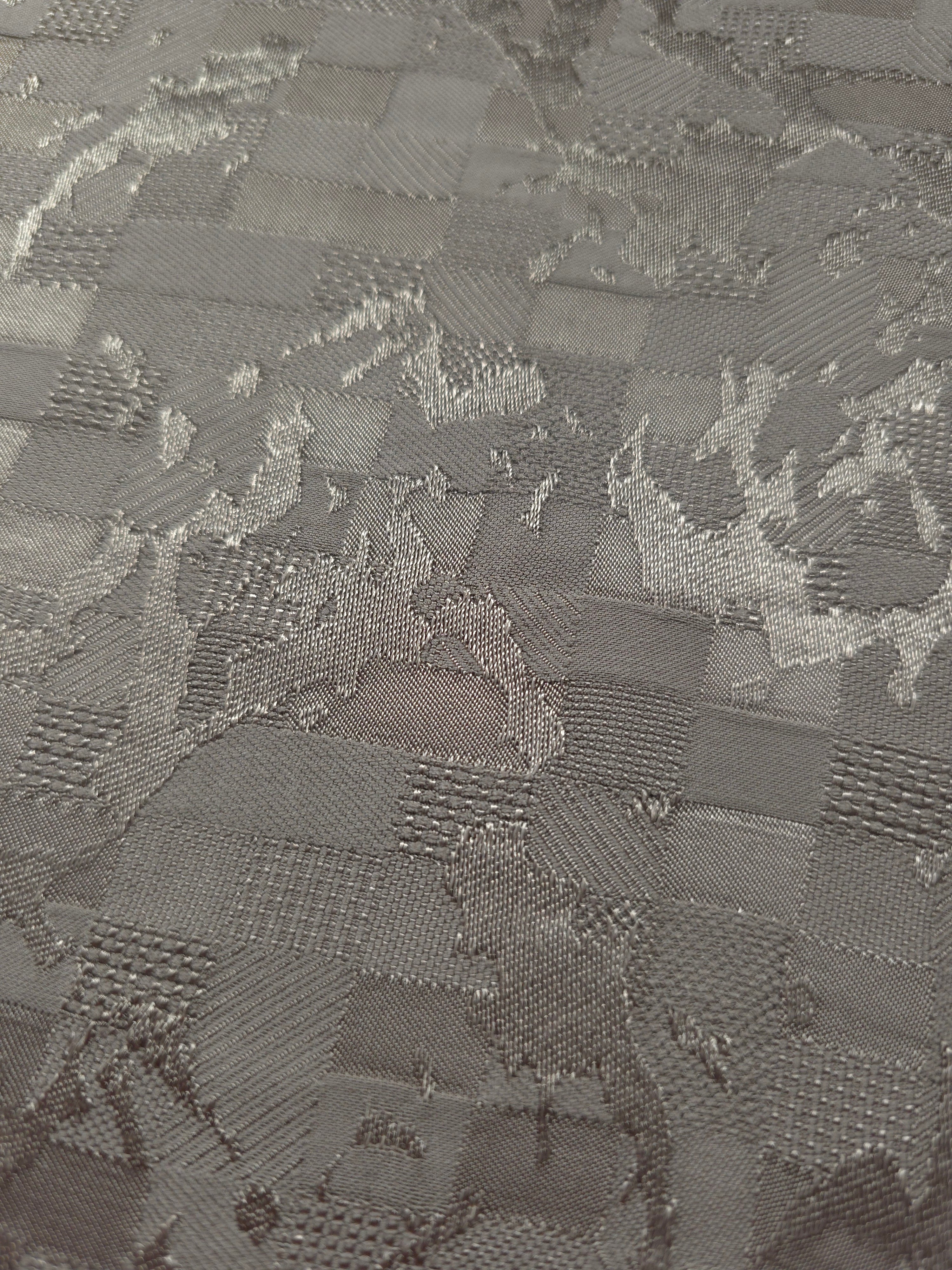 Close-up of tonal splash brick jacquard showing square-weave surface.