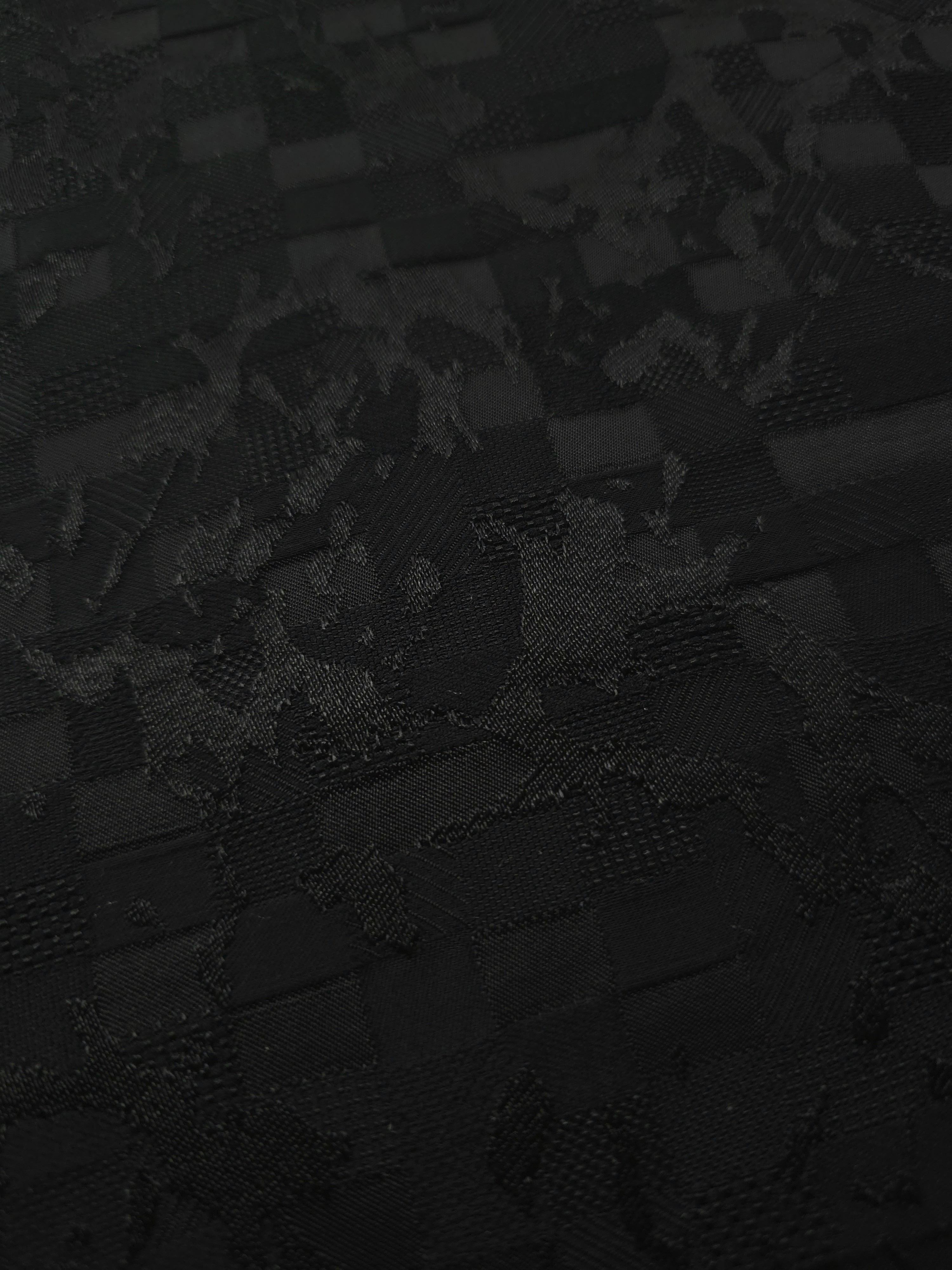 Close-up of splash brick jacquard in another colourway showing woven motif.
