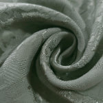 Close drape of splash brick jacquard colourway showing woven fold detail.