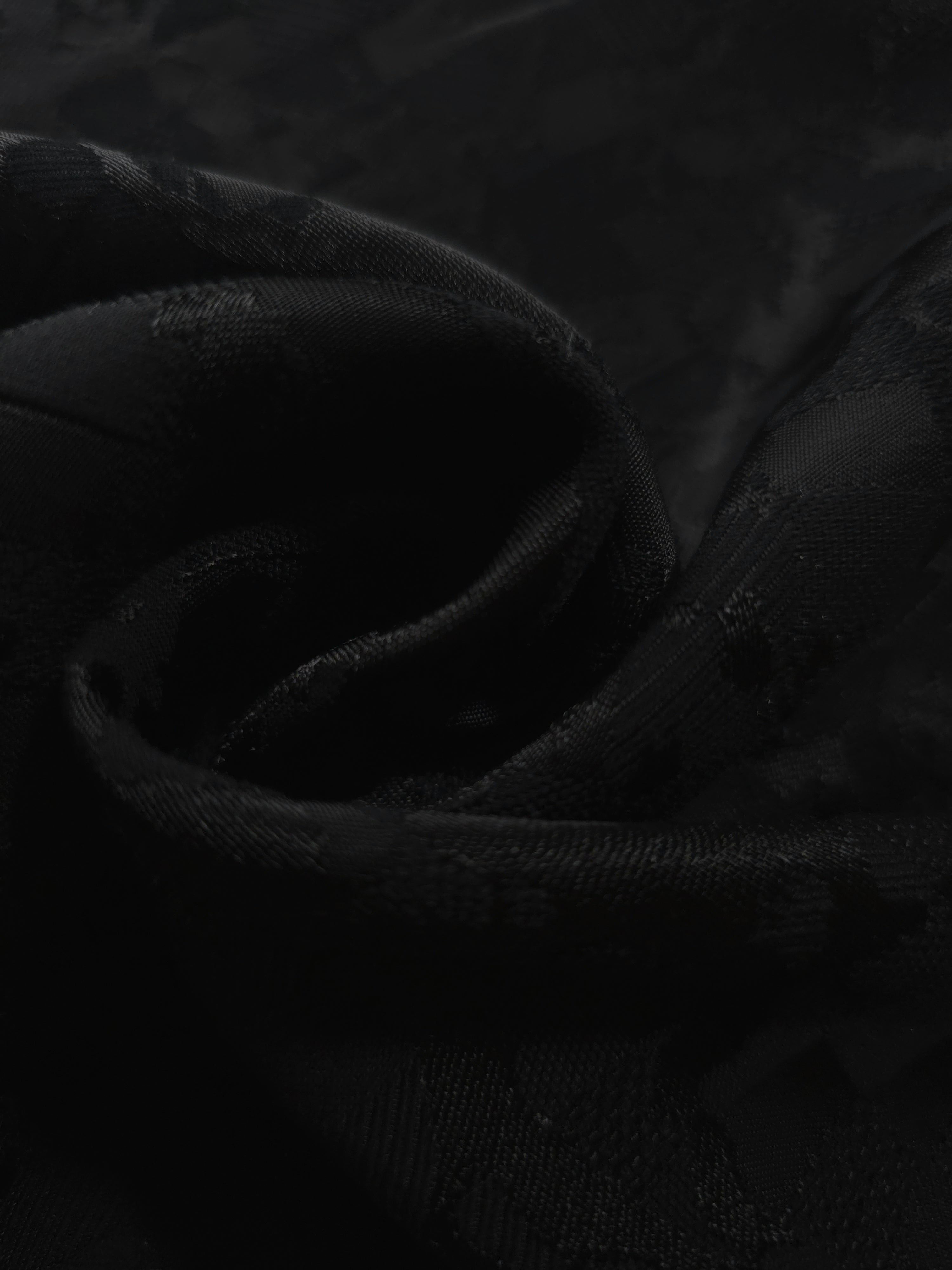 Close drape of splash brick jacquard in another colourway showing fold detail.