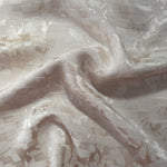 Wave fold of splash brick jacquard showing satin-on-matte woven pattern.