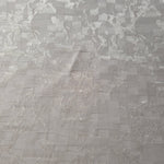 Wide view of splash brick jacquard fabric for dresses and separates.