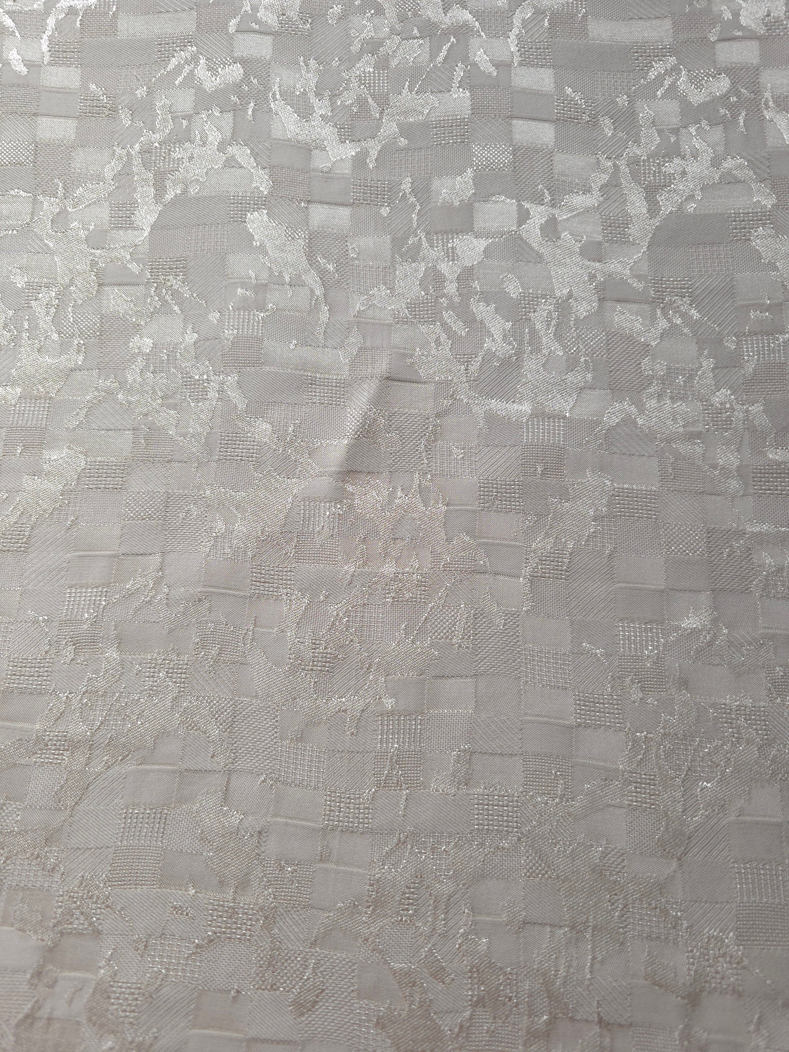 Wide view of splash brick jacquard fabric for dresses and separates.