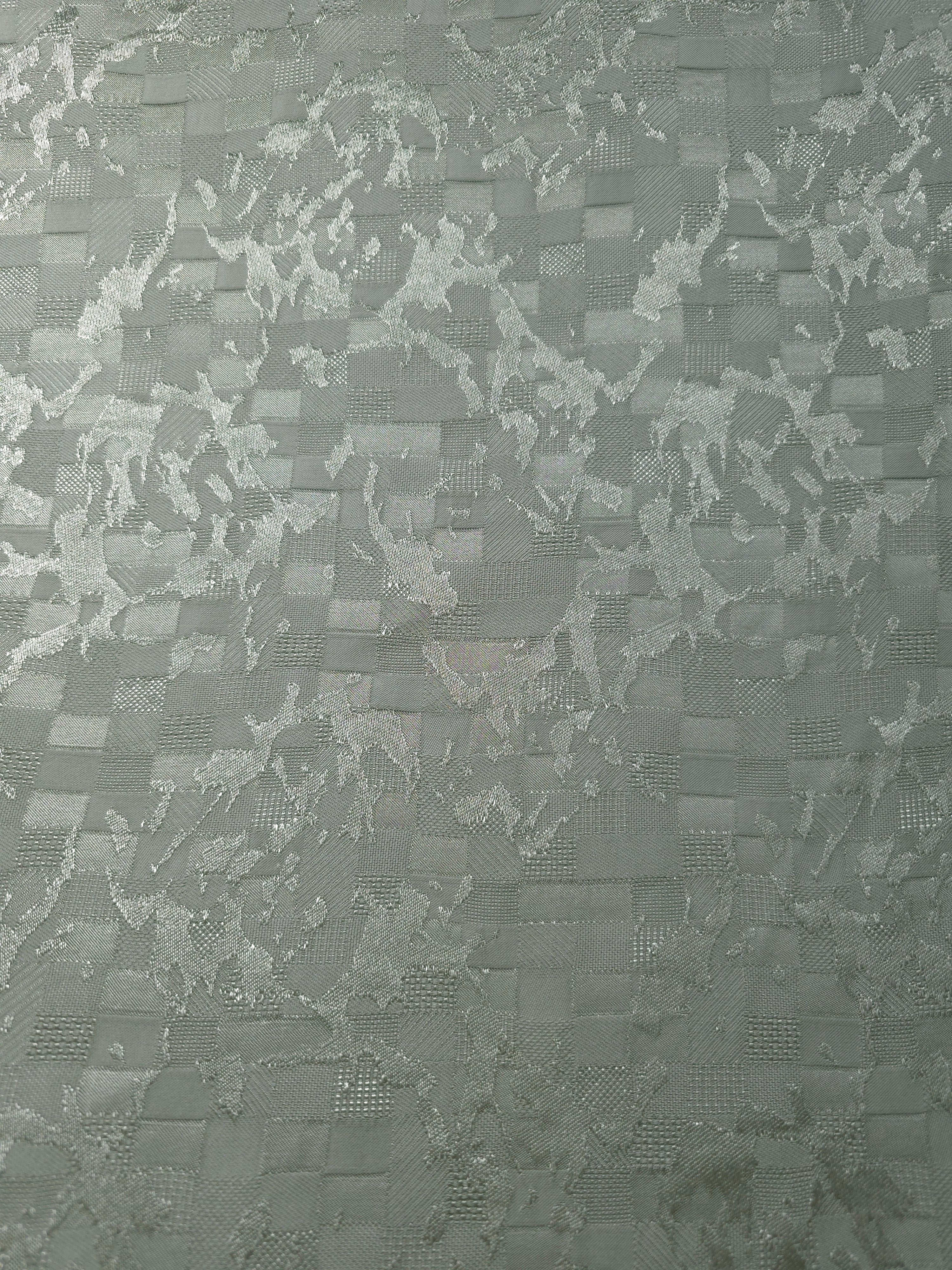 Wide view of splash brick jacquard colourway for dressmaking yardage.
