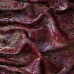 MilanSaten Rainbow Foil fabric in Burgundy, shade 04 — flowing fabric view
