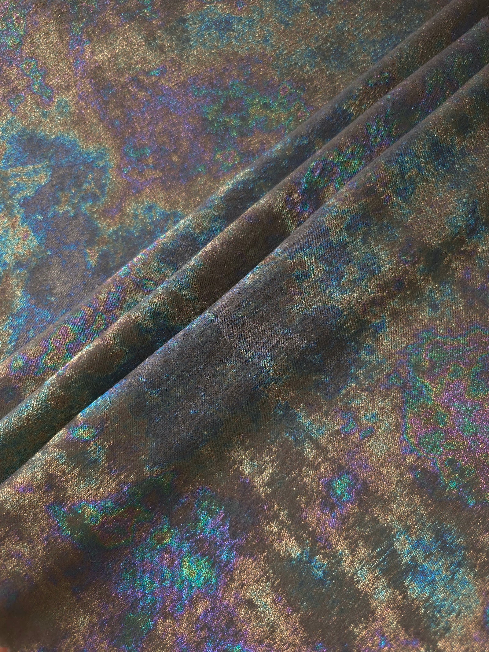 MilanSaten Rainbow Foil fabric in Graphite, shade 108 — flowing fabric view