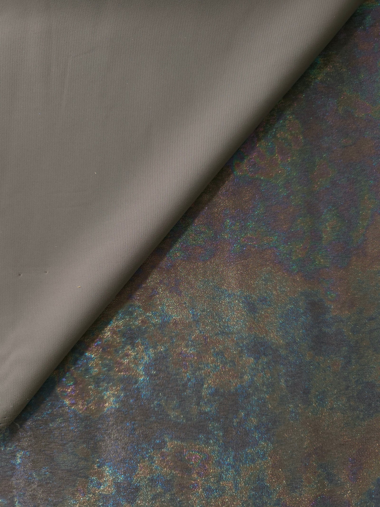 MilanSaten Rainbow Foil fabric in Graphite, shade 108 — full drape view
