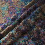 MilanSaten Rainbow Foil fabric in Teal Charcoal, shade 12 — flowing fabric view