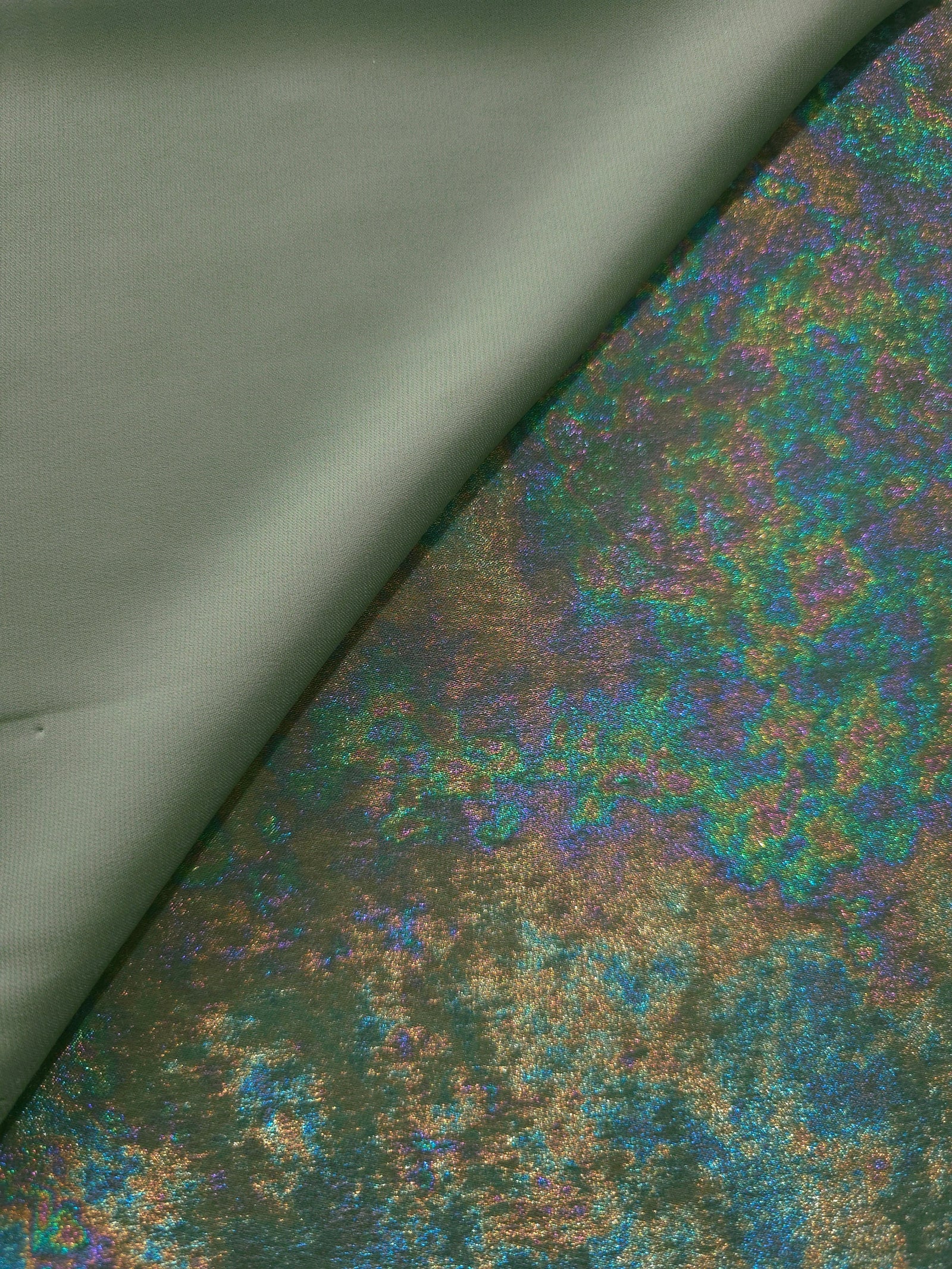MilanSaten Rainbow Foil fabric in Sage Green, shade 74 — folded fabric view