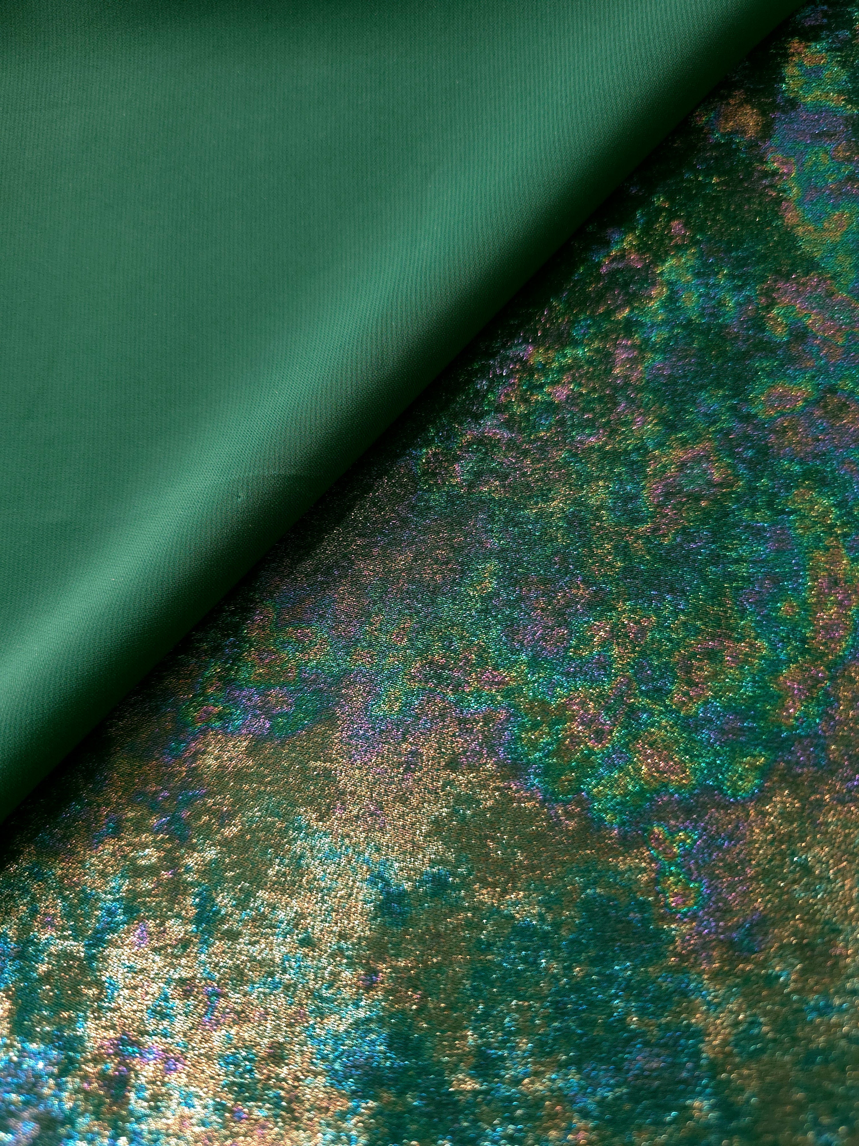 MilanSaten Rainbow Foil fabric in Emerald Green, shade 93 — folded fabric view