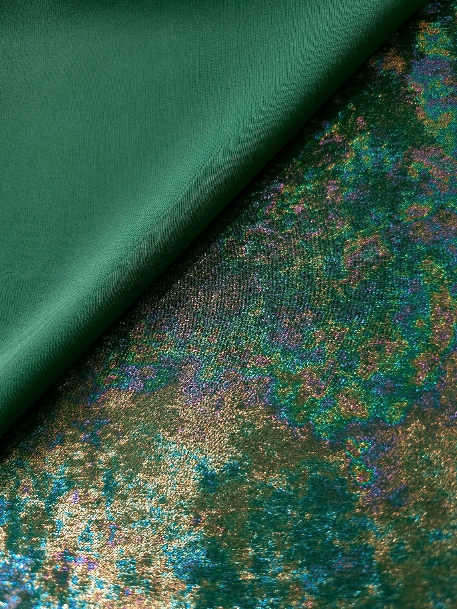 MilanSaten Rainbow Foil fabric in Emerald Green, shade 93 — folded fabric view