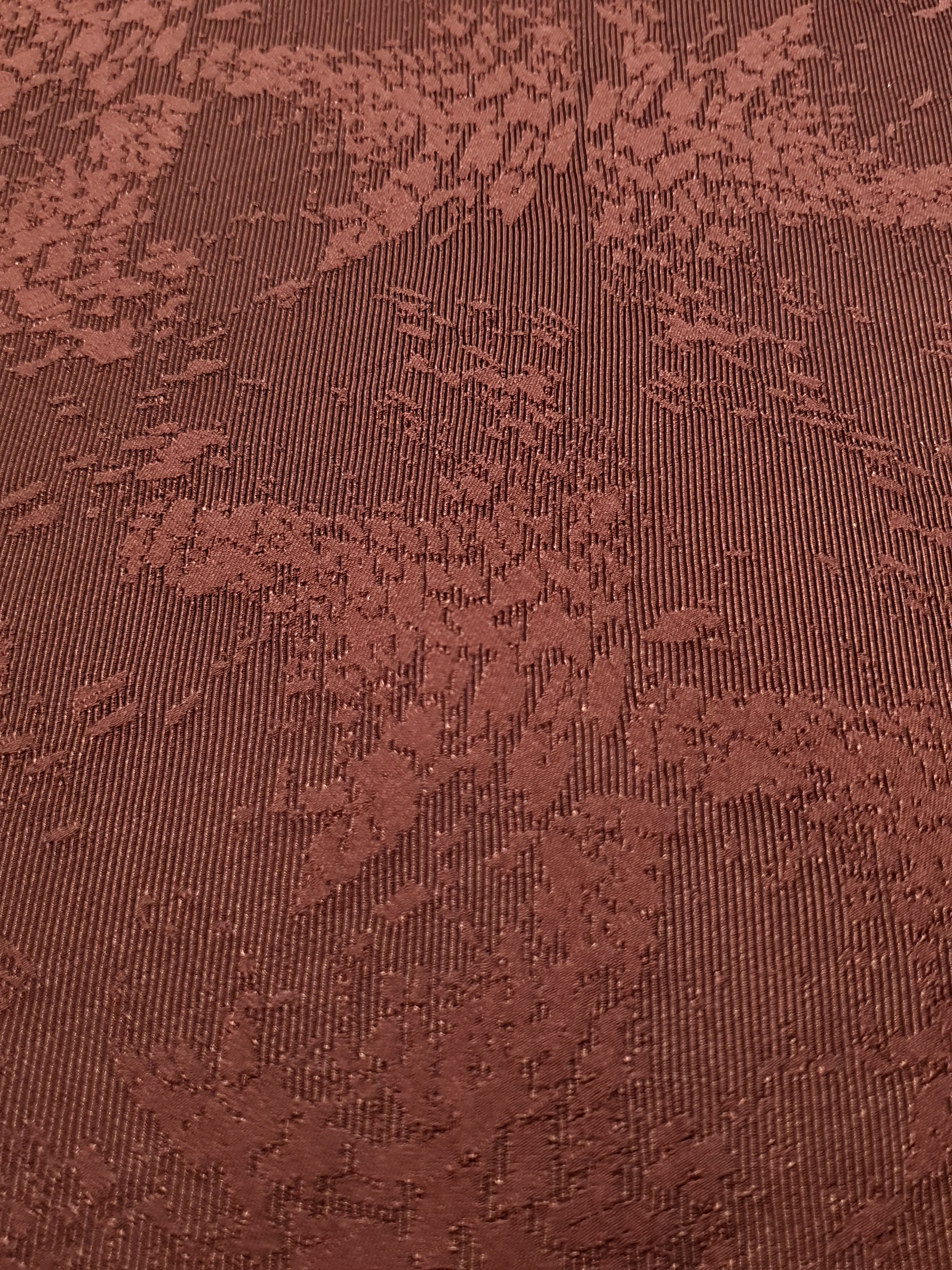 Close detail of animal print rayon jacquard with woven texture.