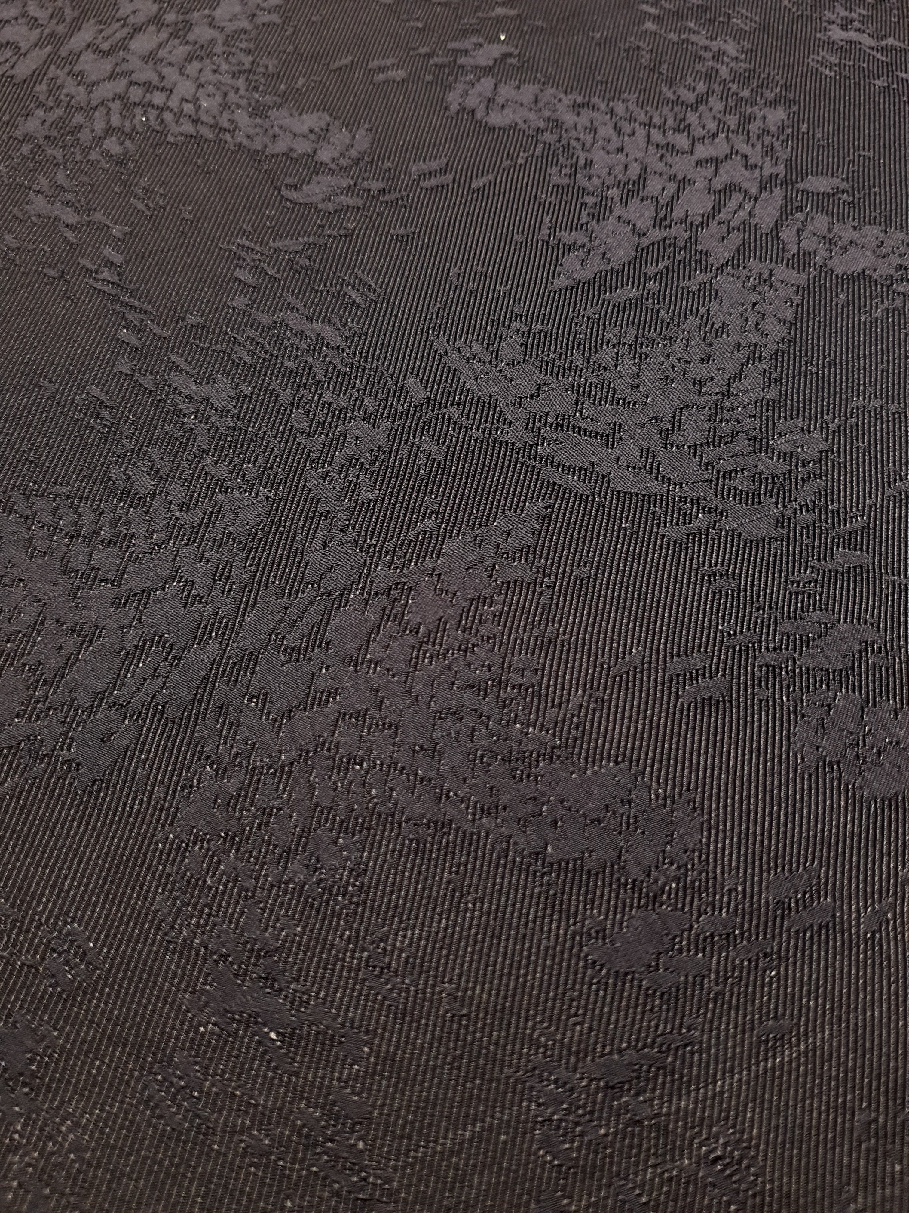 Close detail of structured animal print jacquard with crisp surface.