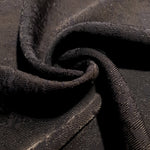 Drape detail of structured animal print jacquard for jackets and skirts.
