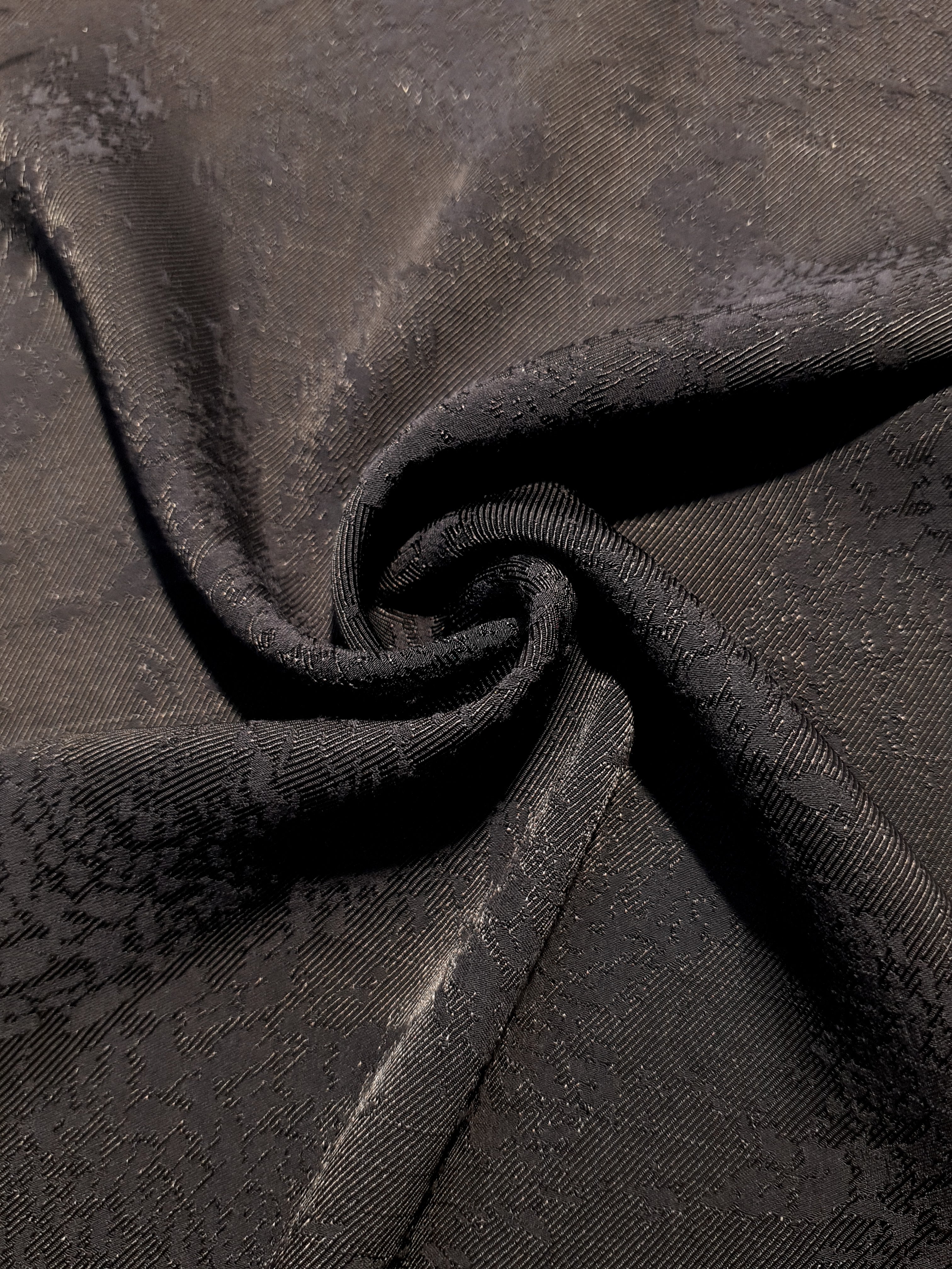 Structured animal print rayon jacquard drape view for statement layers.