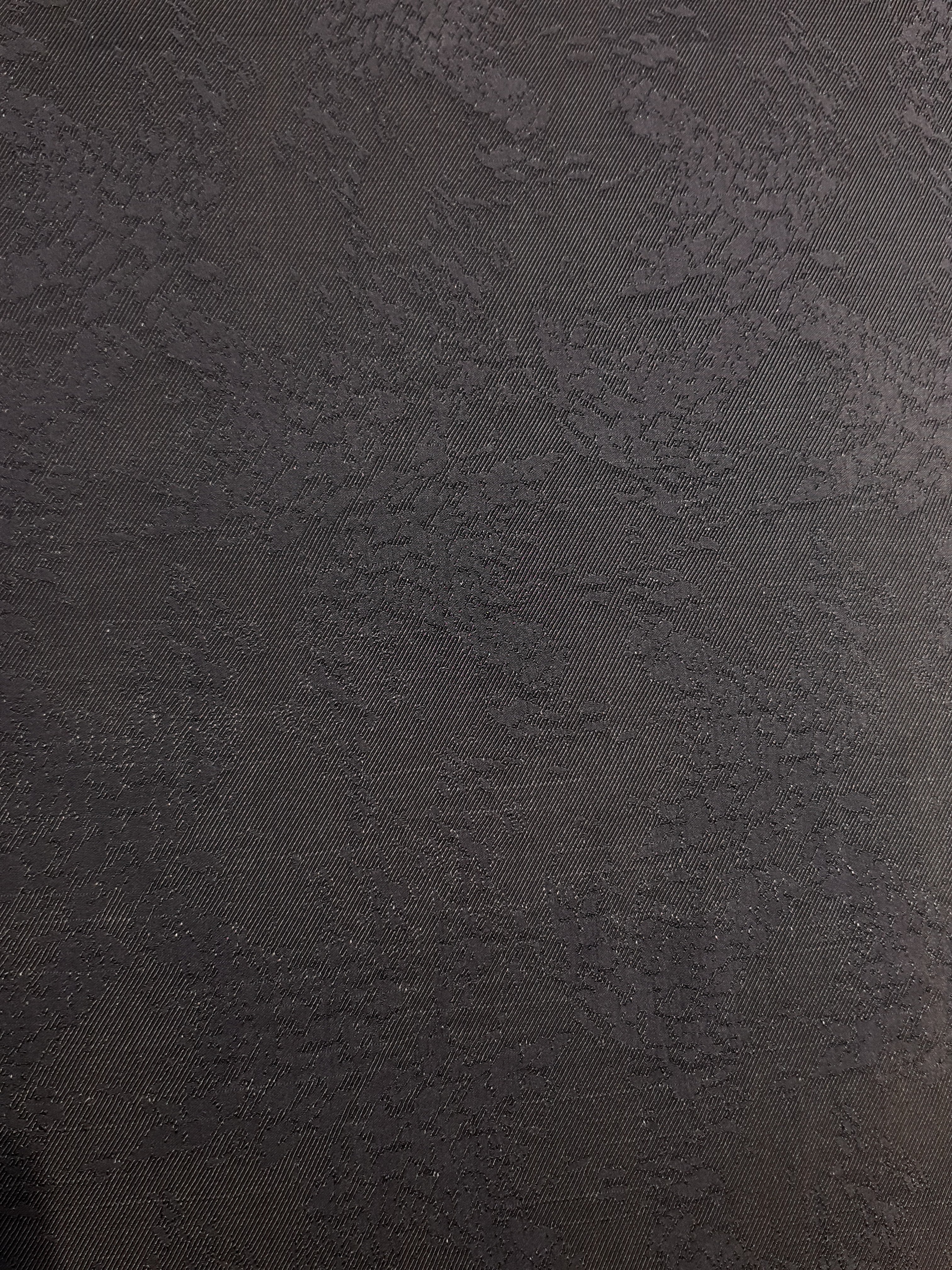 Full view of structured animal print jacquard fabric by the meter.