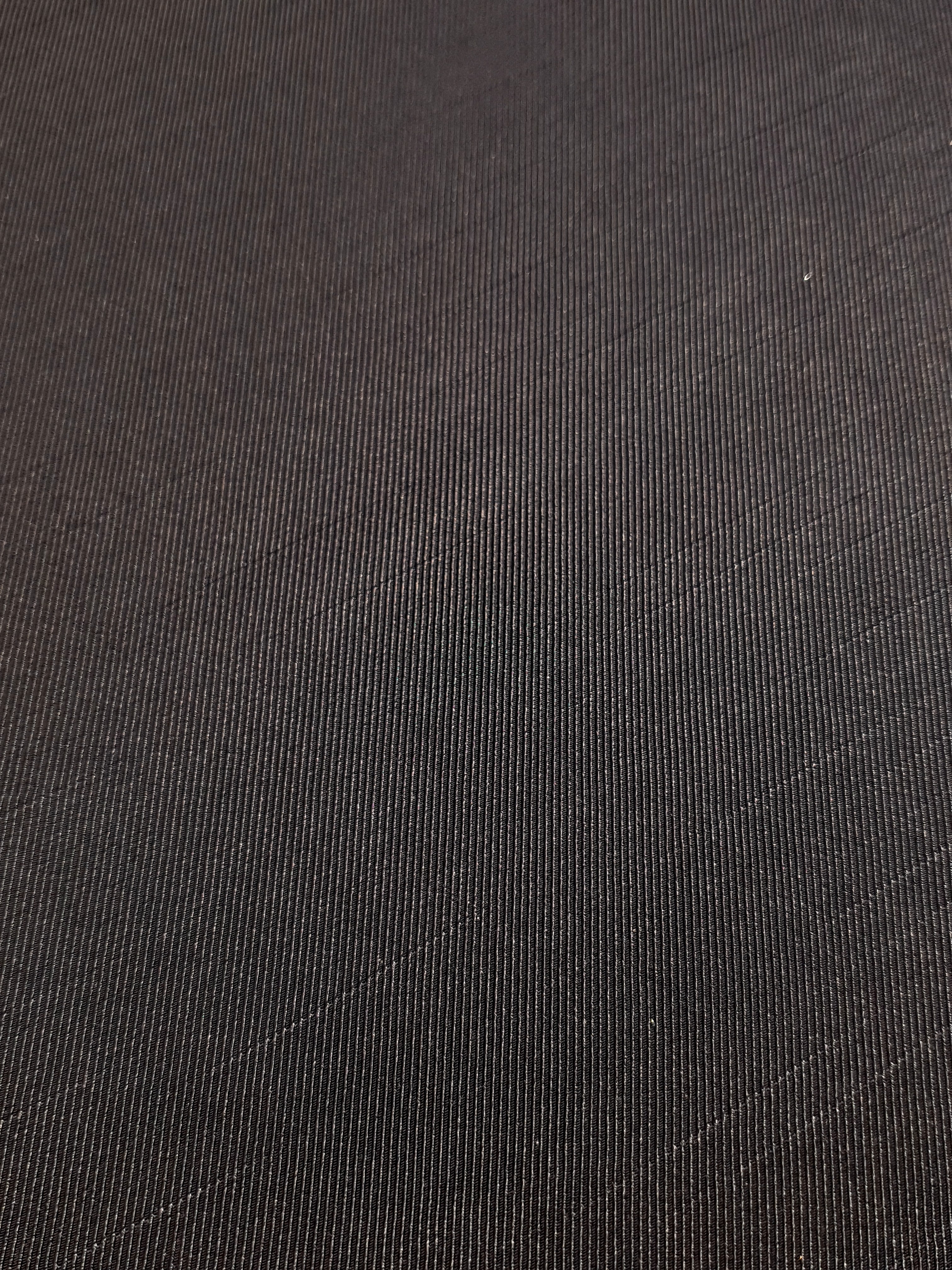 Close detail of structured flat motif jacquard with woven surface.