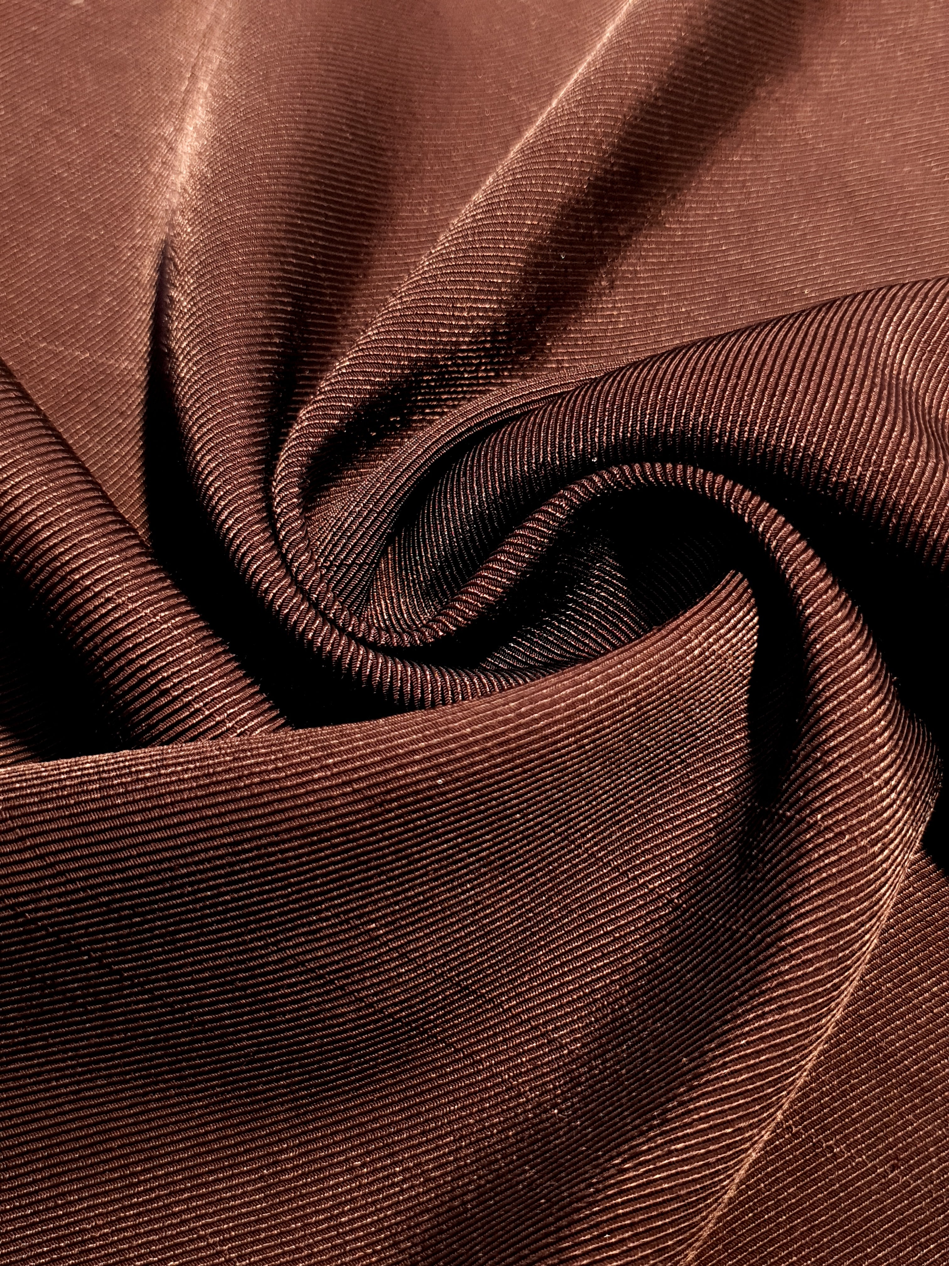 Flat motif rayon jacquard drape detail for dresses and layers.